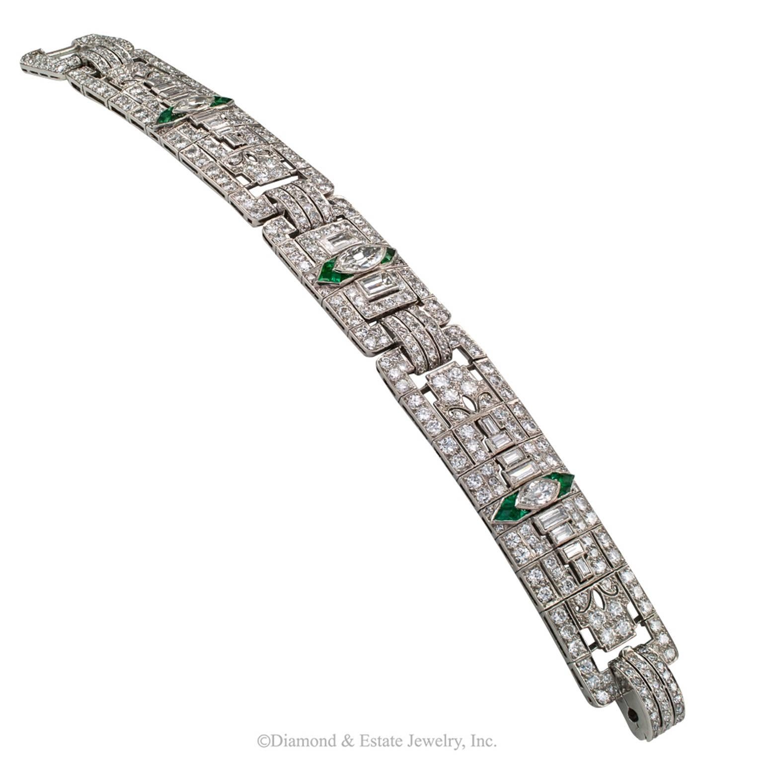 15.50 Carats Diamond Art Deco Platinum Bracelet

15.50 carats diamond and emerald Art Deco platinum bracelet circa 1930.  The wide, geometric-inspired, flexible links are copiously set throughout with diamonds of various shapes and sizes, including