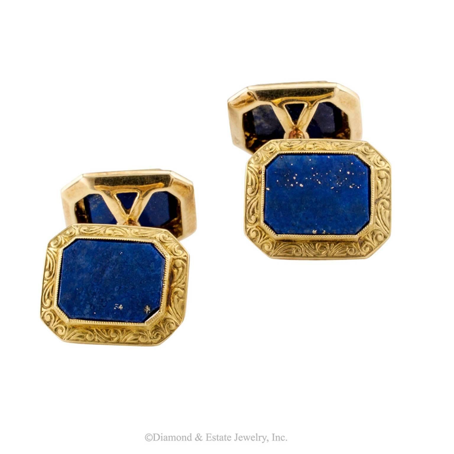 1930s Lapis Lazuli Gold Cuff Links

1930s lapis lazuli and gold cuff links.  The four-sided designs feature natural lapis lazuli rectangular faces within conforming, matte yellow gold borders intensified by classical, organic motifs in relieve. 