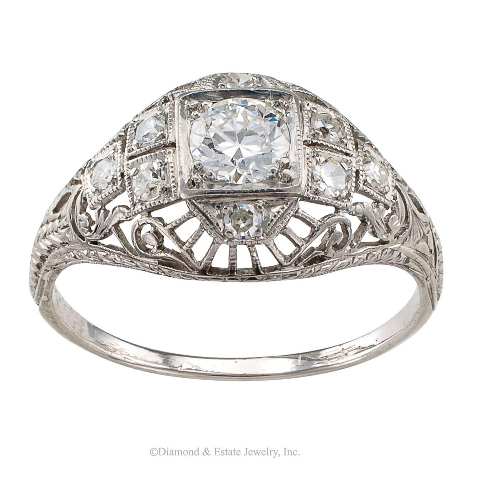 Edwardian Diamond Platinum Engagement Ring

Edwardian engagement diamond and platinum ring circa 1910.  The slightly domed design centers upon a larger old European-cut diamond weighing approximately 0.50 carat, approximately G - H color and SI