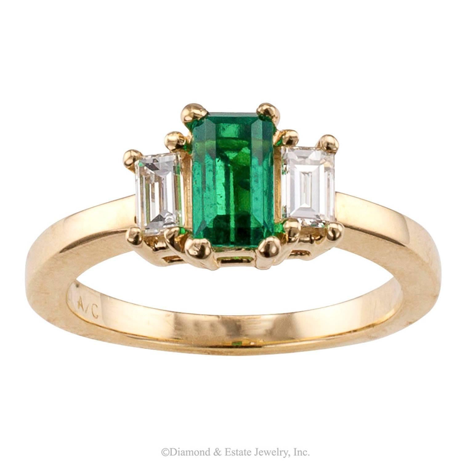Emerald-cut Emerald Diamond Ring

Emerald-cut emerald and diamond ring mounted in 14-karat yellow gold circa 1990.  Dainty and demure, but OH so pretty!  The 0.81 carat emerald-cut emerald accompanied by a report from American Gem Laboratories