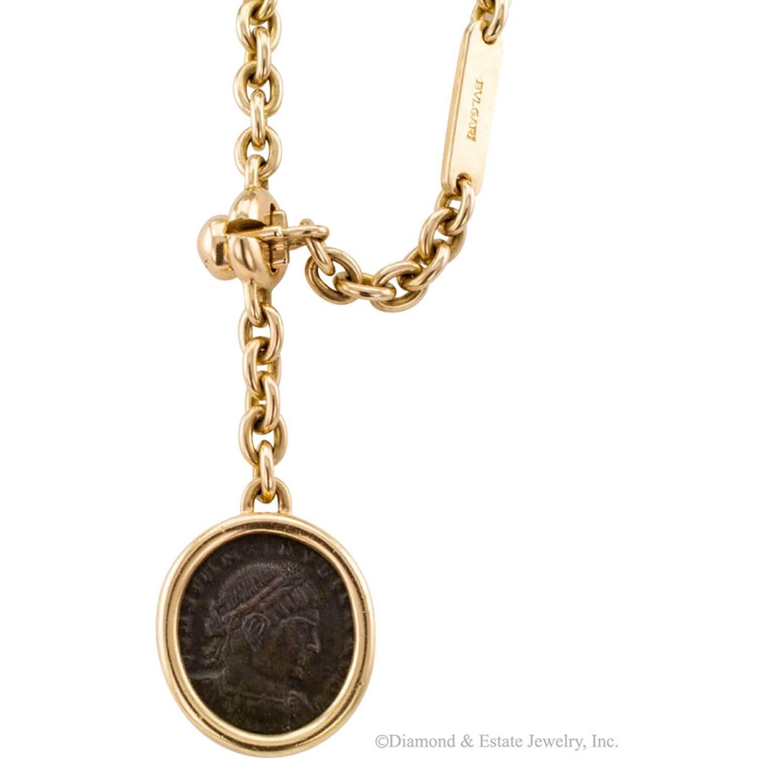 Bulgari Keychain With Ancient Roman Coin

Bulgari gold key chain with ancient Roman coin charm pendant circa 1970.  Crafted in 18-karat yellow gold with a  cleverly engineered clasp that requires the long and thin link to pass through it in order to