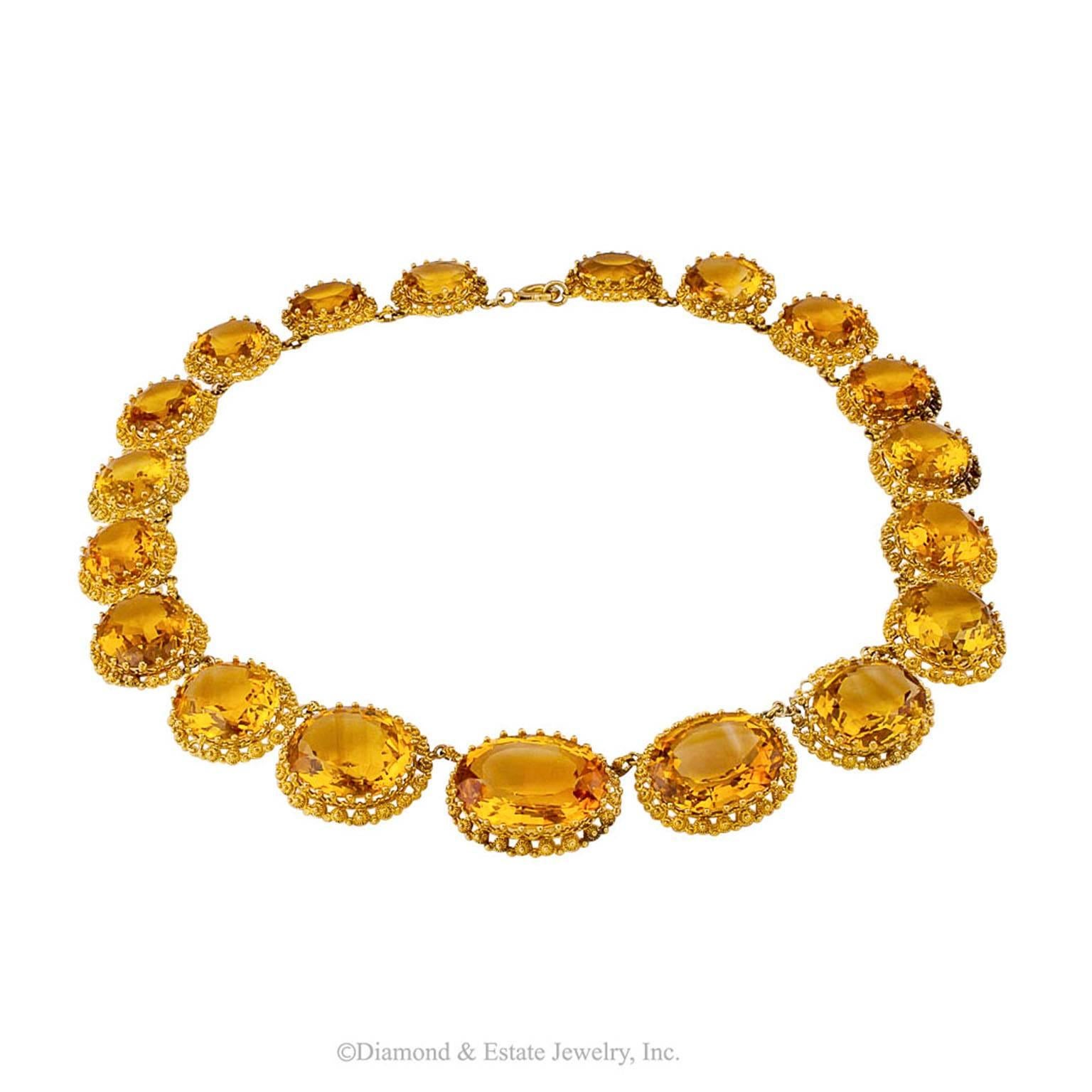 1870s Victorian Citrine Gold Necklace

1870s Victorian citrine and 18-karat gold necklace.  Like large dollops of golden honey strung together, this necklace is delicious eye candy!  Beautifully matched, the nineteen faceted oval citrines total