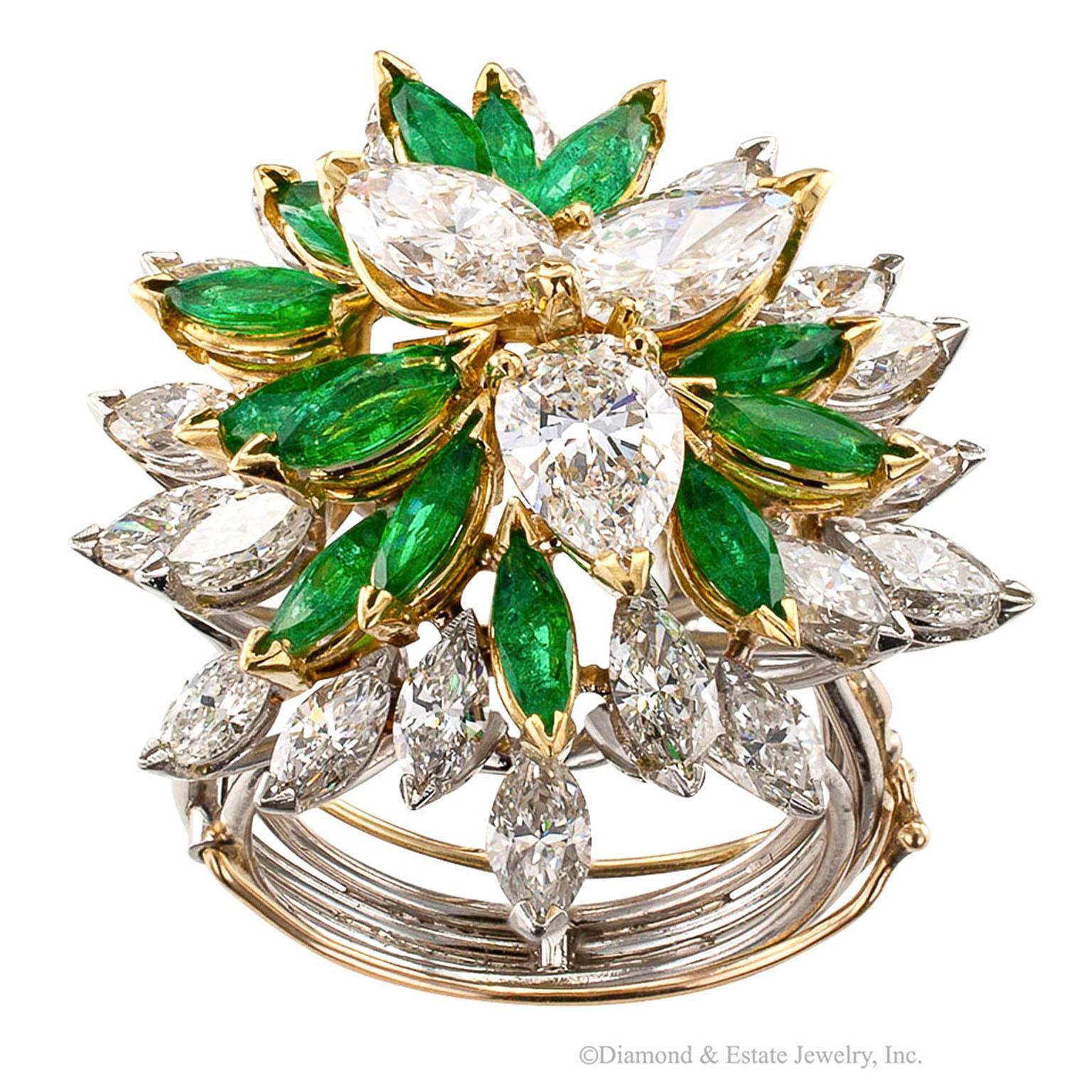 Handmade Emerald Diamond Cocktail Ring Platinum Gold

Handmade cocktail ring with 5.50 carats of diamonds and 2.50 carats of emeralds mounted in platinum and 18-karat gold.  The custom design centers upon a triangular motif fashioned from a trio of