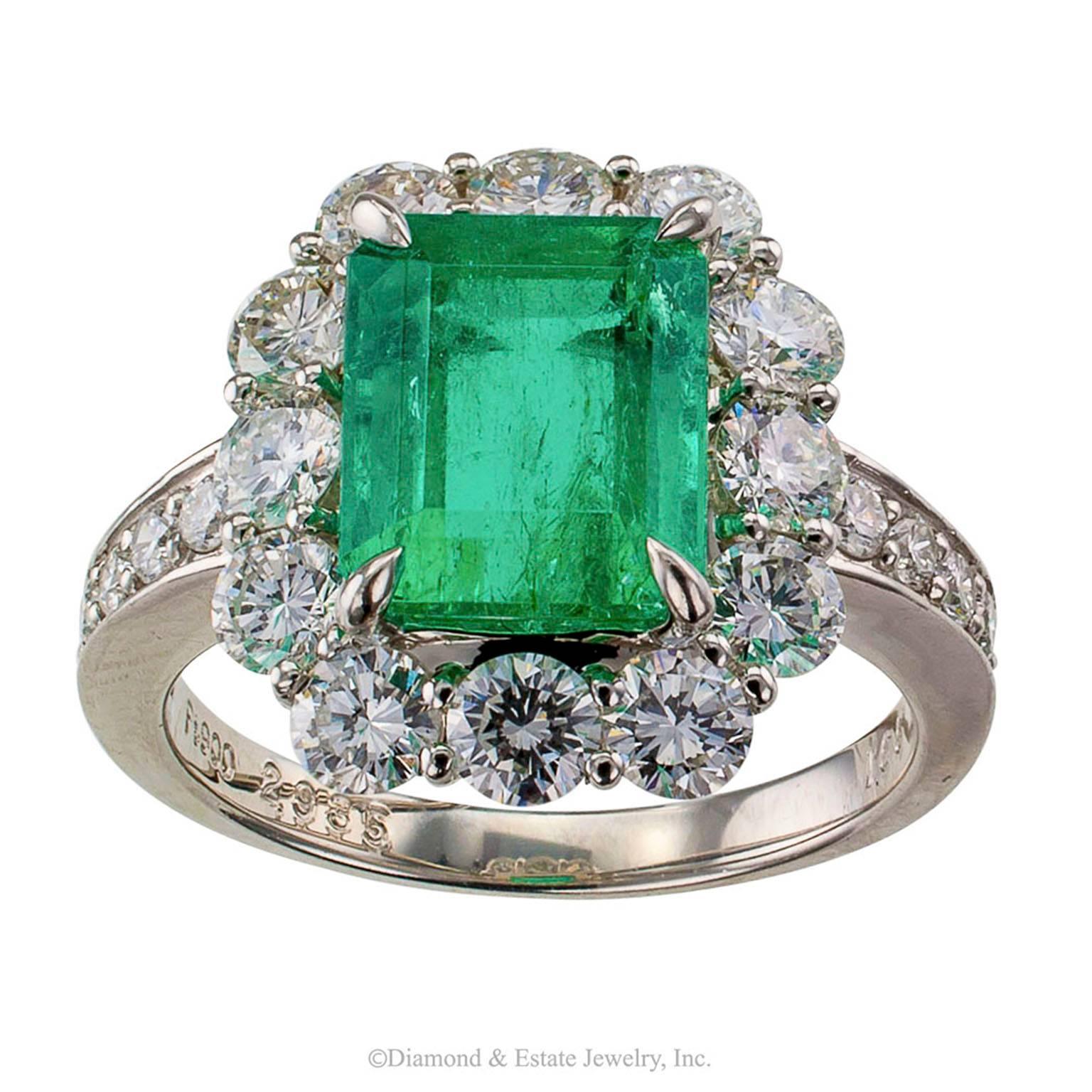 Emerald-cut 2.93 Carats Colombian Emerald Diamond Platinum Ring

Emerald-cut Colombian emerald and diamond ring mounted in platinum circa 1990.  The lively emerald-cut emerald weighing 2.93 carats, within a border of round brilliant-cut diamonds, to