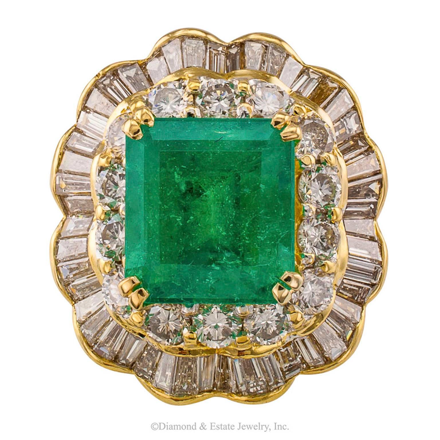 3.75 Carats Square-cut Emerald Diamond Cluster Ring

Square emerald-cut 3.75 carats emerald and diamond ring mounted in 18-karat yellow gold circa 1980.  One could say that this is a smaller scale cocktail ring, but it is no shrinking violet.  The