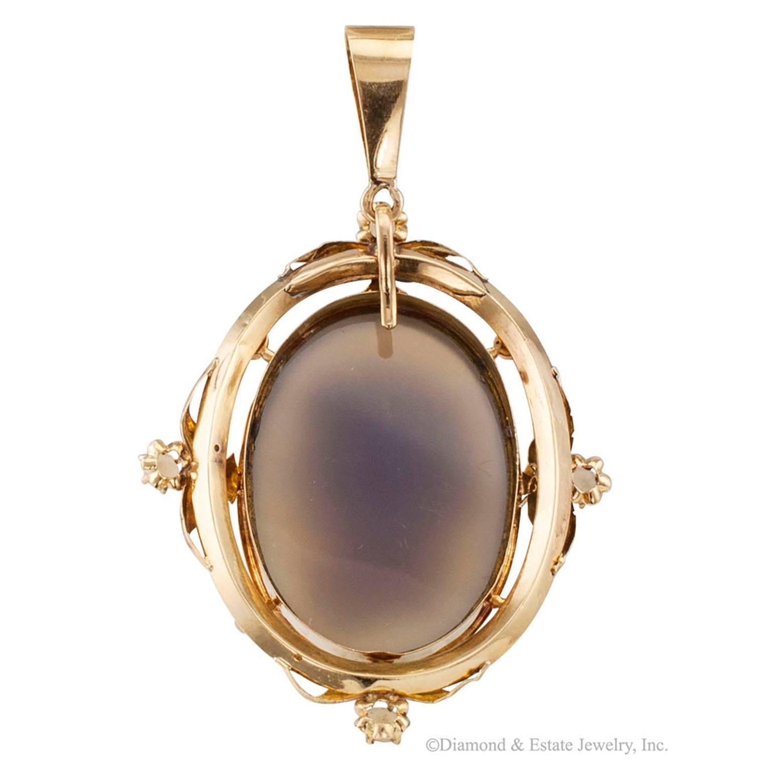 Victorian 1850s Hard Stone Cameo Pearl Gold Pendant

Victorian 1850s hard stone pearls and 18-karat gold cameo pendant.  Very pristine.  The crisp and highly detailed sardonyx carving depicts the profile of a woman's head facing right, with