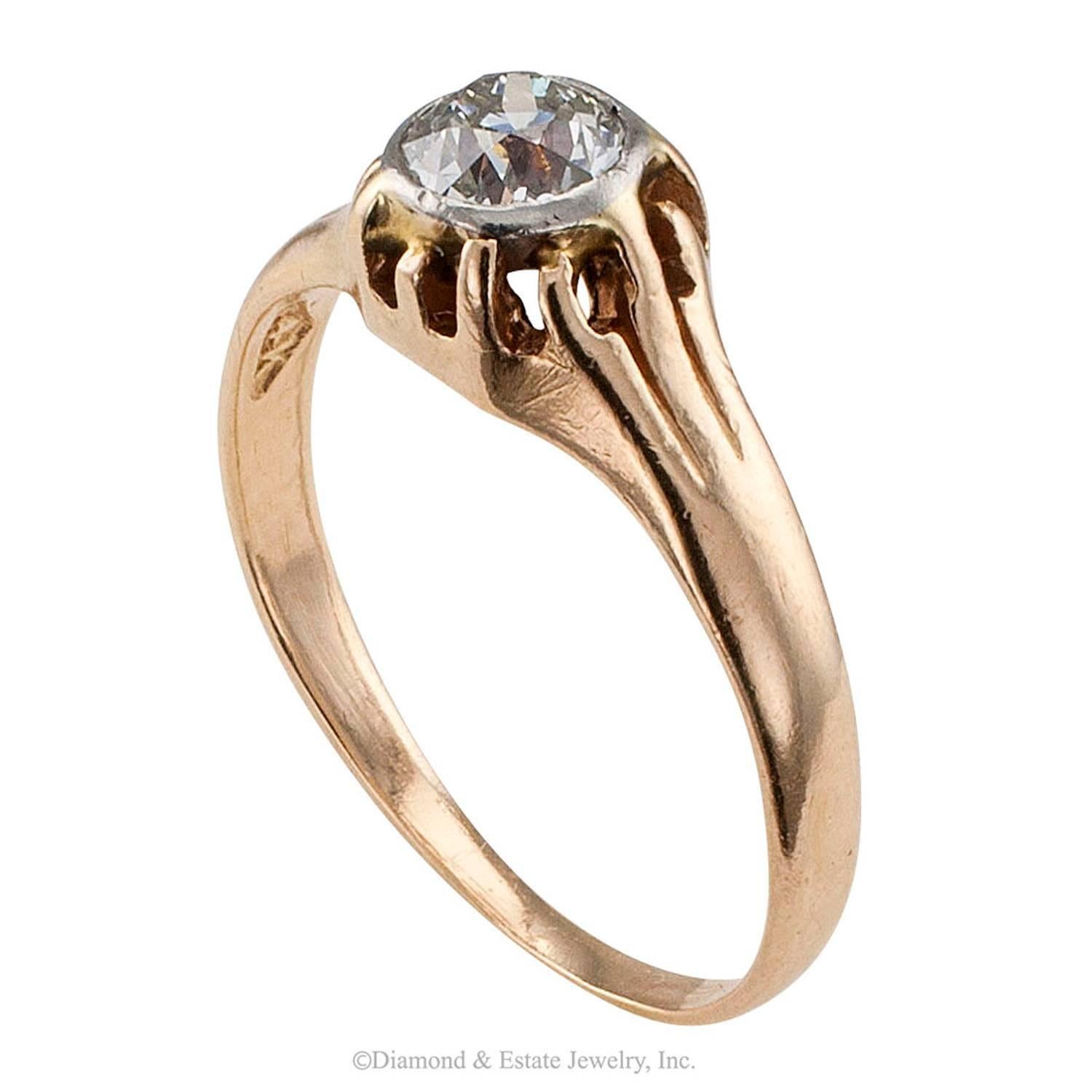 Victorian 0.35 Carat Diamond Gold Engagement Ring

Victorian 0.35 carat old mine-cut diamond solitaire gold engagement ring circa 1890.  The single, approximately 0.35 carat, approximately J color and SI1 clarity, old mine-cut diamond crowns the
