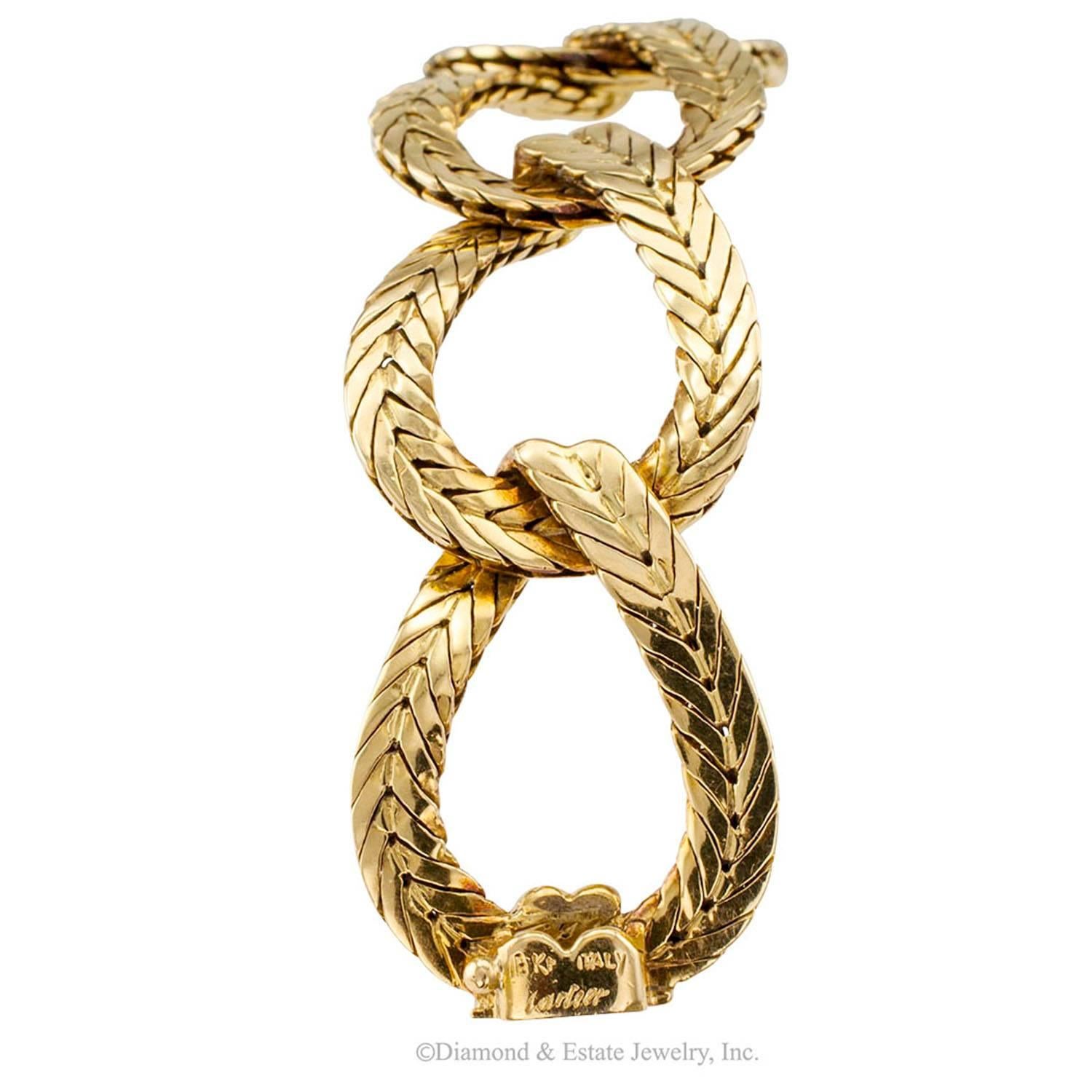 Cartier 1960s Wide Open Link Gold Bracelet

Cartier 1960s wide open link gold bracelet circa 1960.  Buttery soft and supple 18-karat gold... this elegant open link bracelet doesn't need anyone calling out its pedigree.  It speaks for itself. 