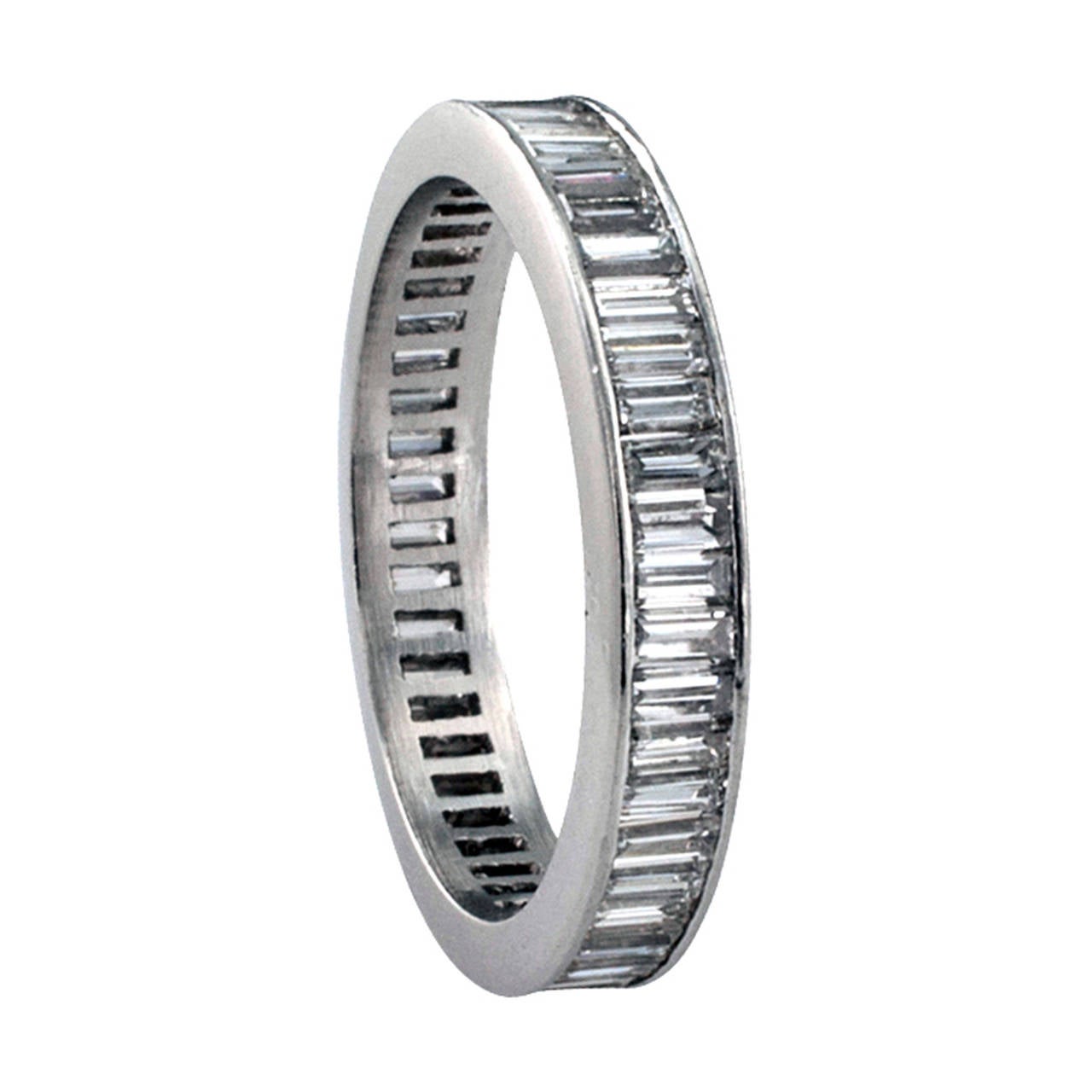 2.00 Carats Baguette Diamond Platinum Eternity Ring

Circa 1950, continuously set with forty-eight baguette diamonds totaling approximately 2.00 carats, approximately H color and VS clarity, mounted in platinum, 3 1/2 mm wide, ring size = 6.  A