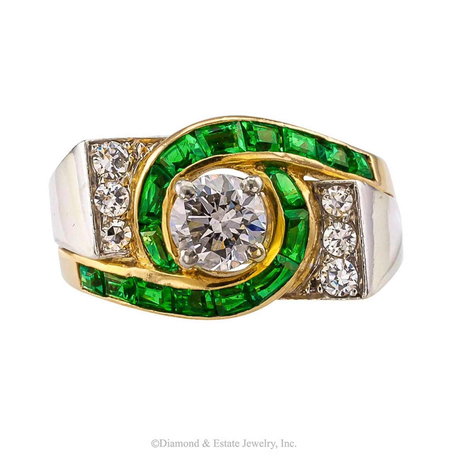 Modernist 1950s Emerald Diamond Gold Platinum Ring

Modernist 1950s emerald and diamond ring crafted in 18-karat gold and platinum.  The design features a round diamond weighing approximately 0.60 carat, approximately H color and VS - SI clarity,