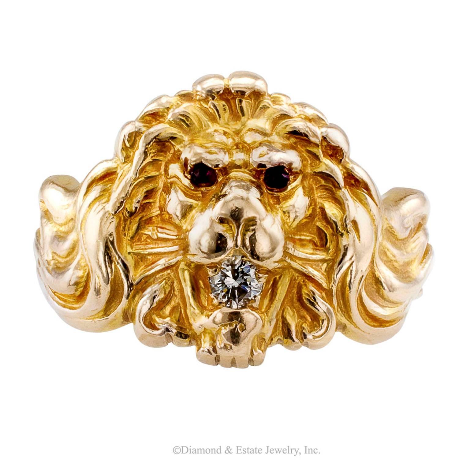 1930s Lion Head Ring Ruby Diamond Gold

Gentleman's 1930s lion head ring with a diamond in the mouth and ruby-set eyes mounted in 14-karat gold with maker's mark for Church & Co.  Behold a lion ring like no other.  Its appearance belies its vintage,