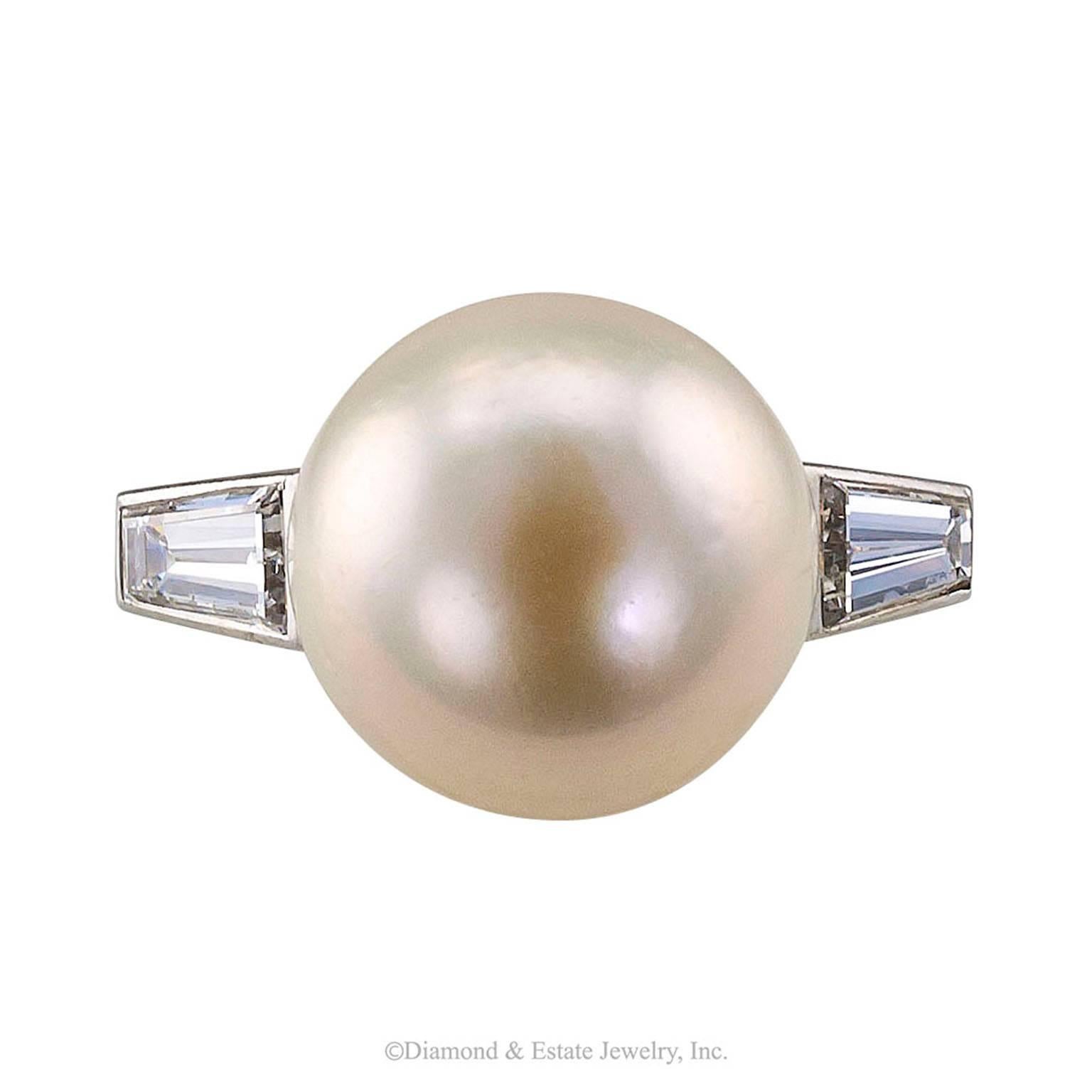 Mid-century French South Sea Pearl 11.4 mm Diamond Platinum Ring

French mid-century south sea pearl and baguette diamond platinum ring circa 1950.   The quintessential platinum ring design from the 1950's is still riding high on the crest of