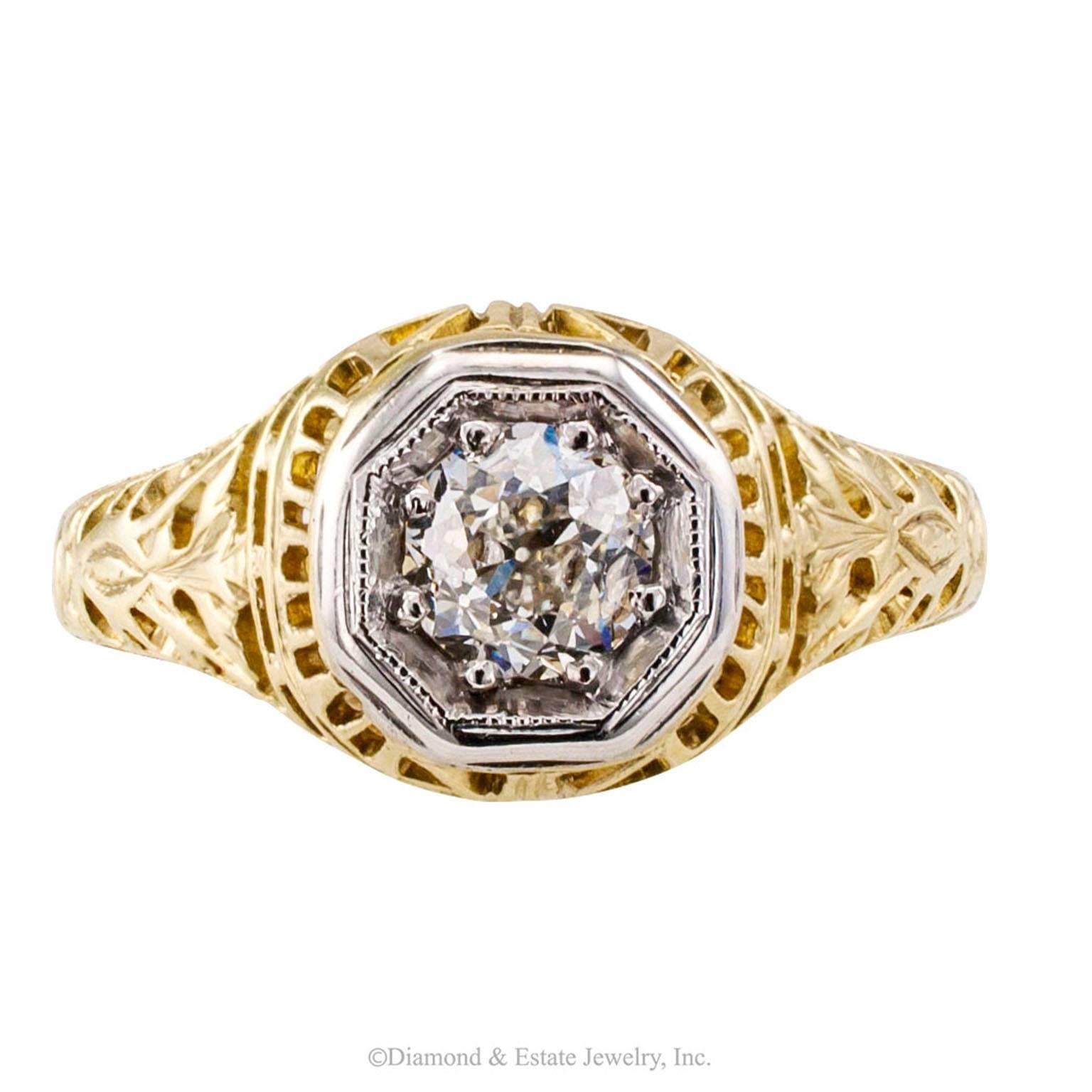 Old Mine-cut Diamond 0.35 Carat Art Deco Gold Engagement Ring

Art Deco 0.35 carat old mine-cut diamond solitaire mounted in two-tone gold circa 1930.  Authentic Art Deco engagement ring crafted in 14-karat yellow gold, crowned by a contrasting,