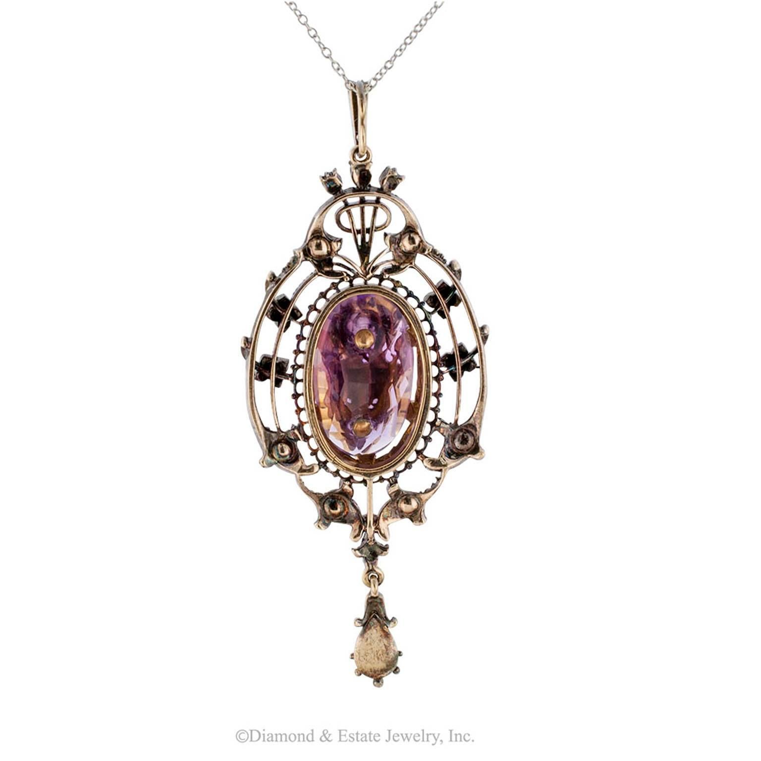 Victorian 1850s Amethyst Pearl Diamond Gold Silver Pendant

Victorian 1850s amethyst diamond and pearl pendant mounted in silver and gold.  This is high voltage, early Victorian romanticism artfully arranged into a lovely design that holds no bars