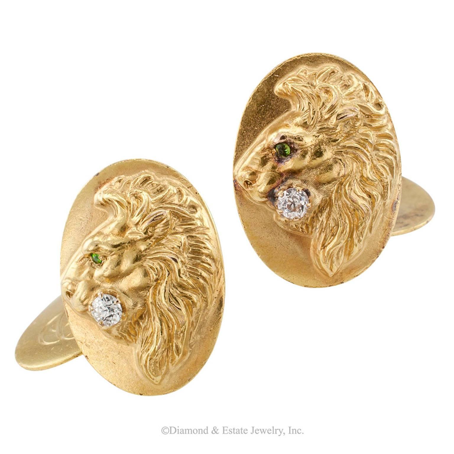 Art Nouveau Demantoid Garnet Diamond Gold Cuff Links

Art Nouveau demantoid garnet and diamond lion head gold cuff links circa 1905.  The front faces depicting in relief the profile of a male lion, the eye set with a faceted demantoid garnet and a