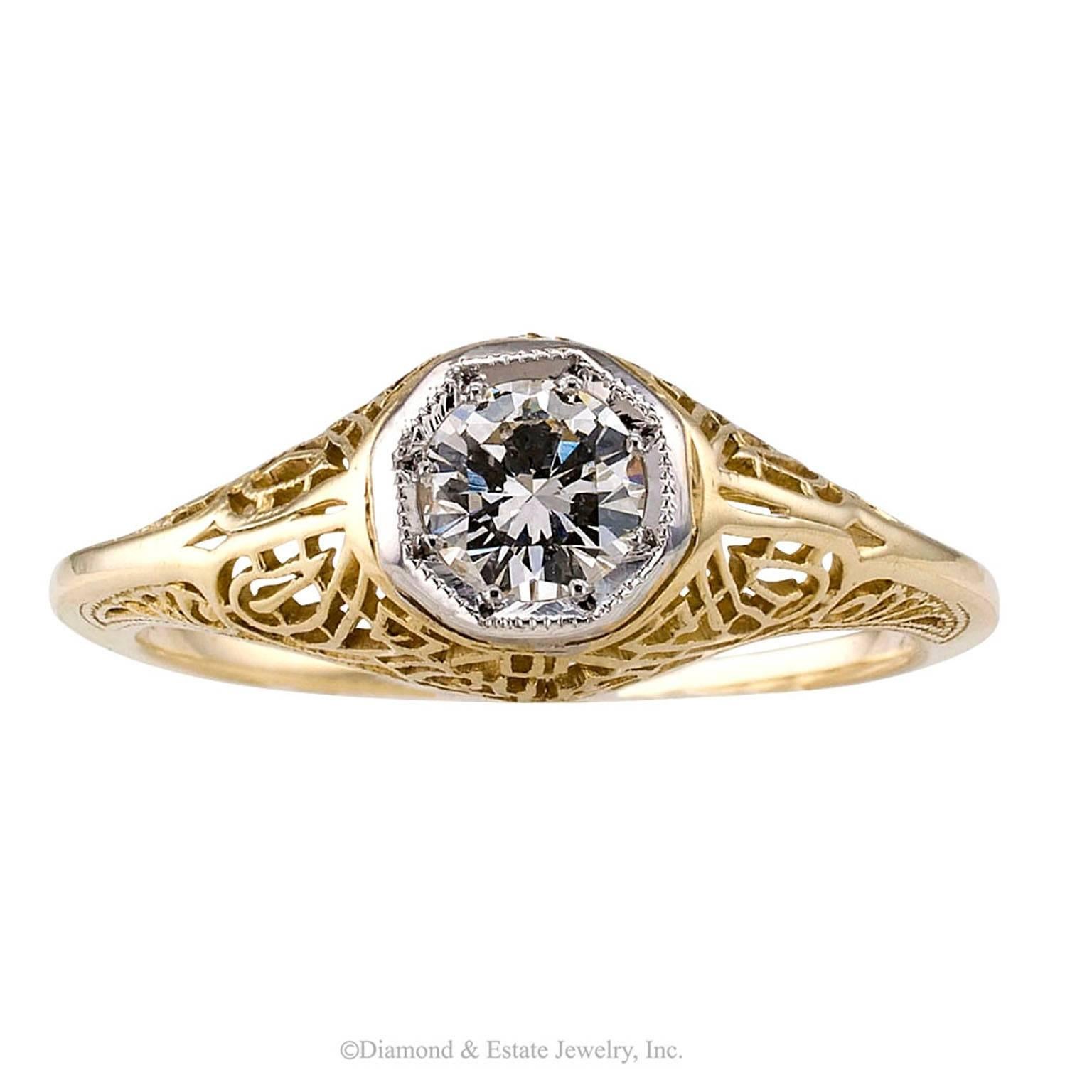 Art Deco 1930s 0.33 Carat Gold Diamond Engagement Ring

Art Deco 1930s 0.33 carat diamond solitaire  yellow gold ring.  Lavishly decorated with fine filigree work, this authentic Art Deco diamond engagement ring centers upon a transitional-cut