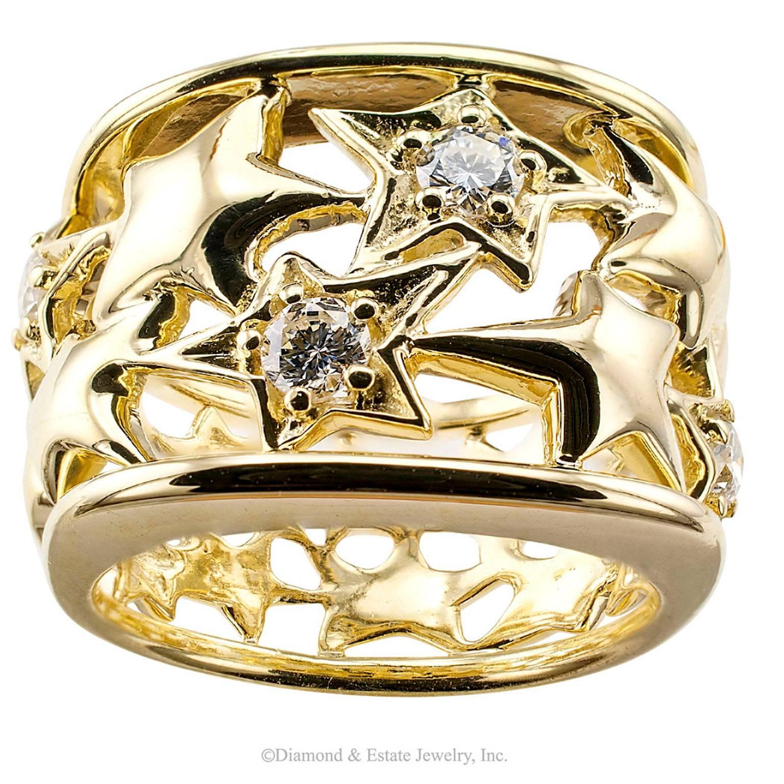 Jose Hess Diamond Gold Wide Ring Band

Jose Hess 1990s star ring band with diamonds and 18-karat gold.  If you want to wrap the stars around your finger, here is your opportunity.  This stylish 18-karat yellow gold wide ring band features a pierced