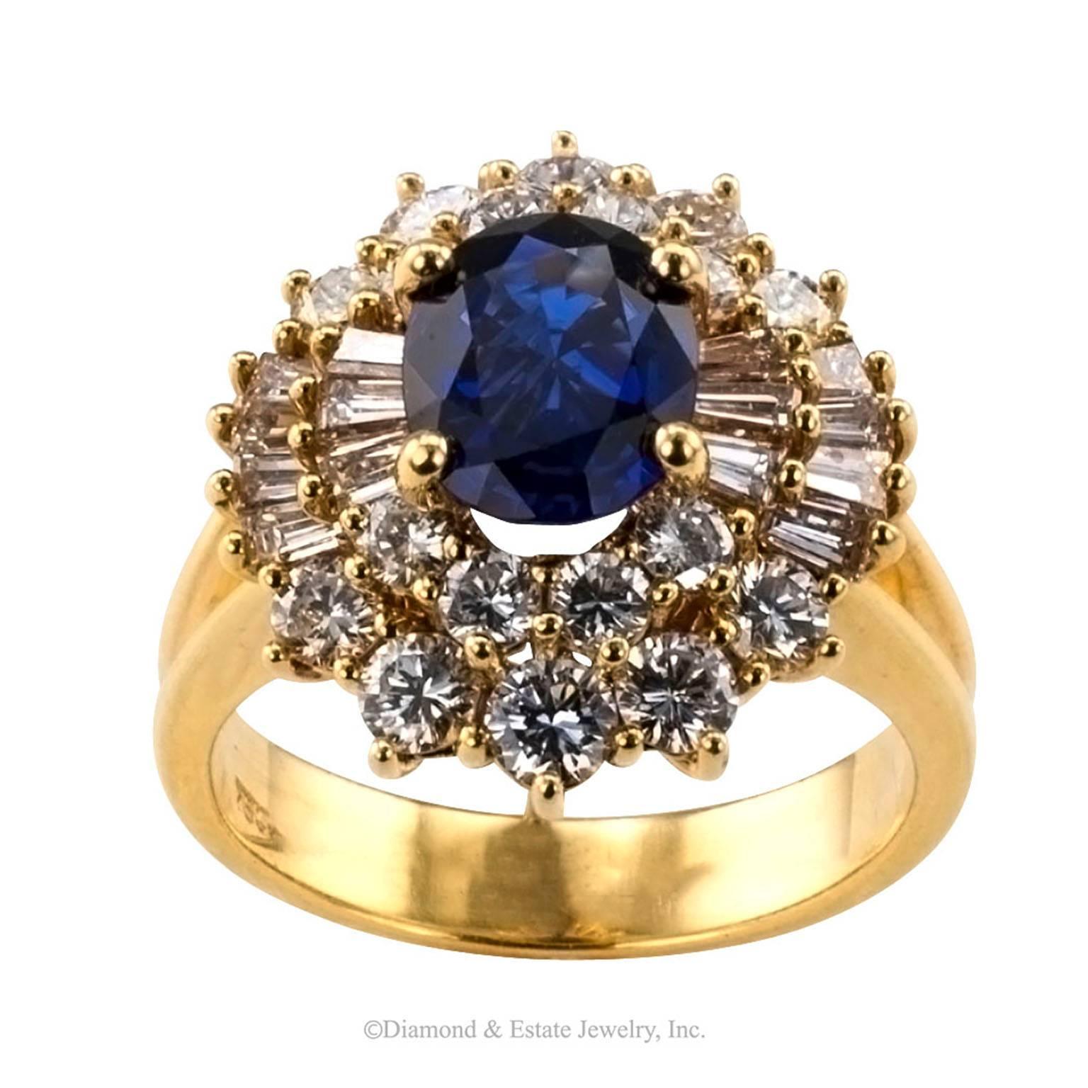 Diamond Sapphire Gold Cluster Ring

Estate 1970s sapphire and diamond cluster ring mounted in 18-karat yellow gold.  A classic design very typical of the period when it was made, but characterized a timeless aesthetic.  Showcasing a royal-blue oval