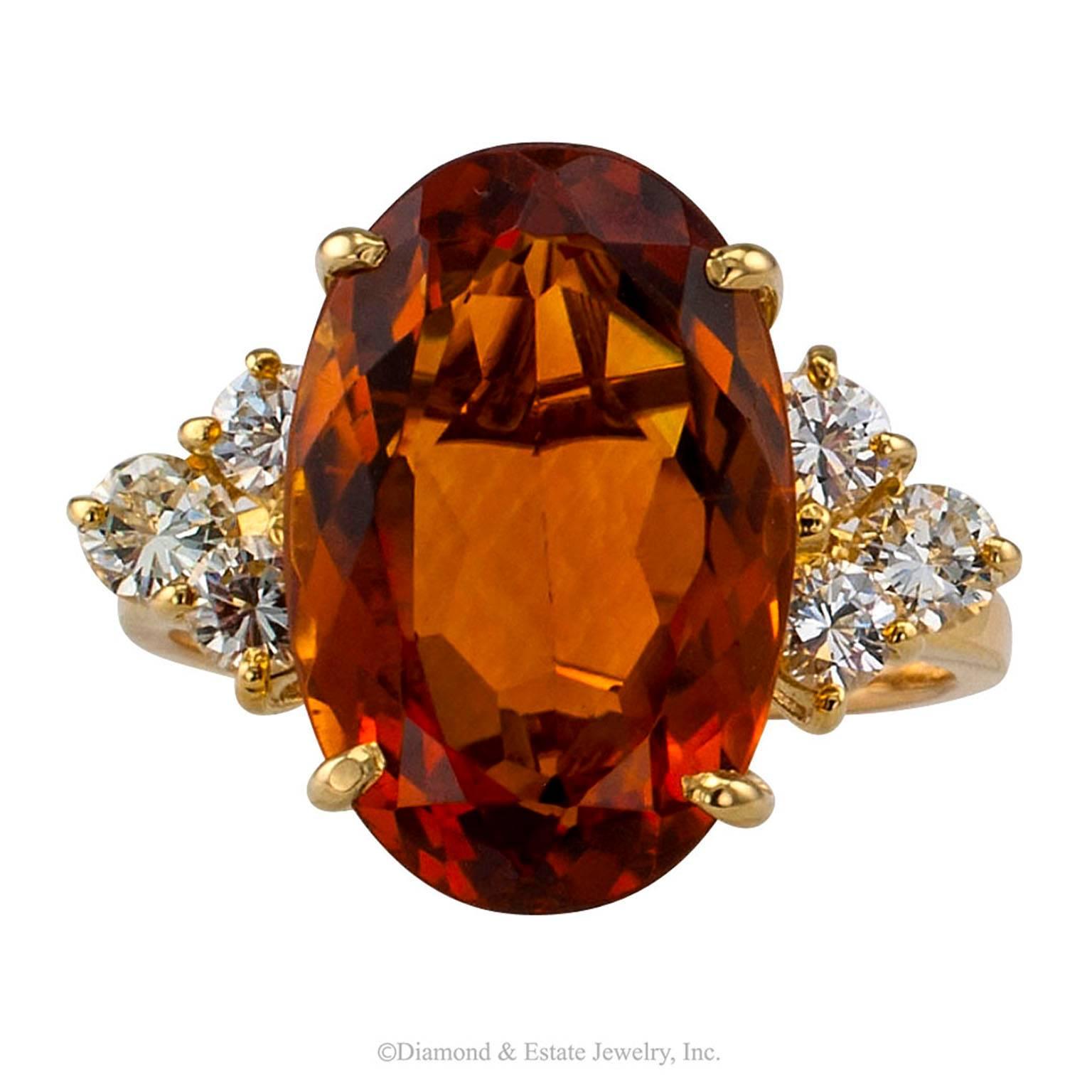 Madeira Citrine Diamond Gold Cocktail Ring

Madeira citrine gold and diamond cocktail ring.  The formidable design showcases a large, elongated oval citrine weighing approximately  7.50 carats, cuddled at the shoulders by round brilliant-cut diamond