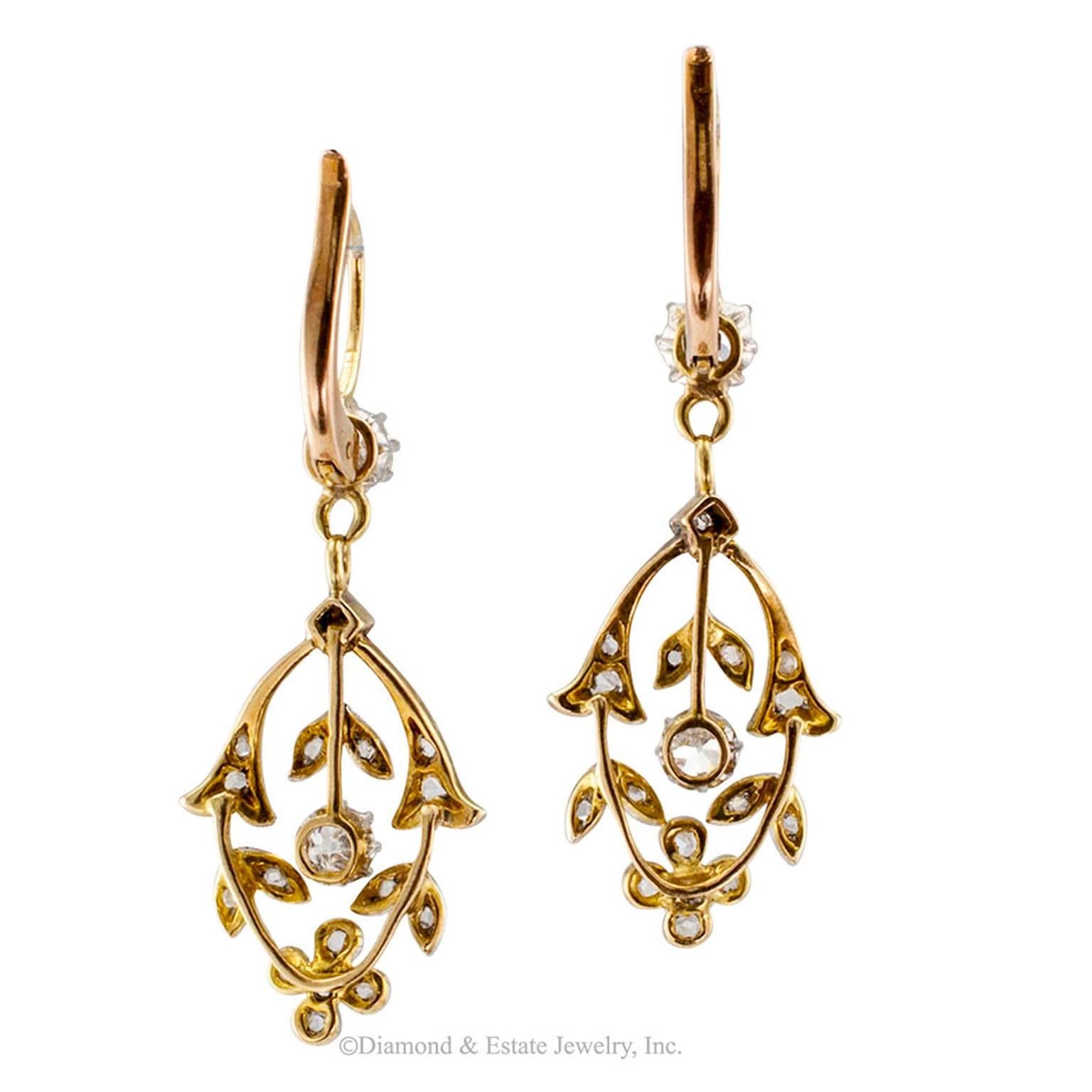 Edwardian 1910 Diamond Gold Platinum Pendent Earrings

Edwardian 1910 pendant earrings set with old mine and rose-cut diamonds in platinum and gold.  The articulated garland motif designs are embellished with old mine-cut and rose-cut diamonds