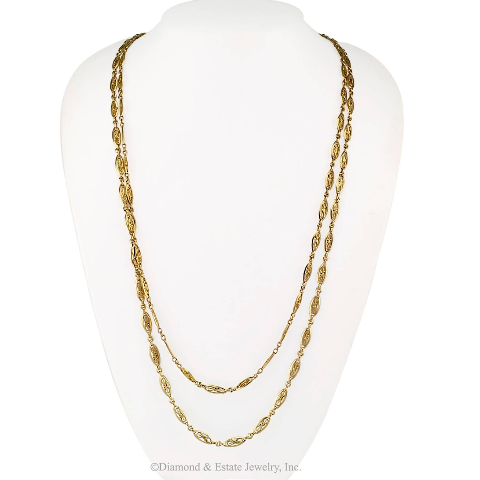 French Antique 1905 Long Chain Necklace

French 1905 Art Nouveau 18-karat gold long chain.  A continuous loop of hand made links crafted in 18-karat gold, long enough to wear doubled or even tripled around the neck.  Long chains have always been a