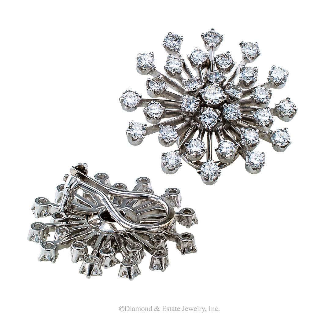 1950s Snowflake Diamond Platinum Ear Clips

Mid Century diamond and platinum snowflake ear clips circa 1950.  Diamond snowflake earrings dispersing vast qualities of that fiery ice lightning effect that makes diamonds so endearing.  In this case,