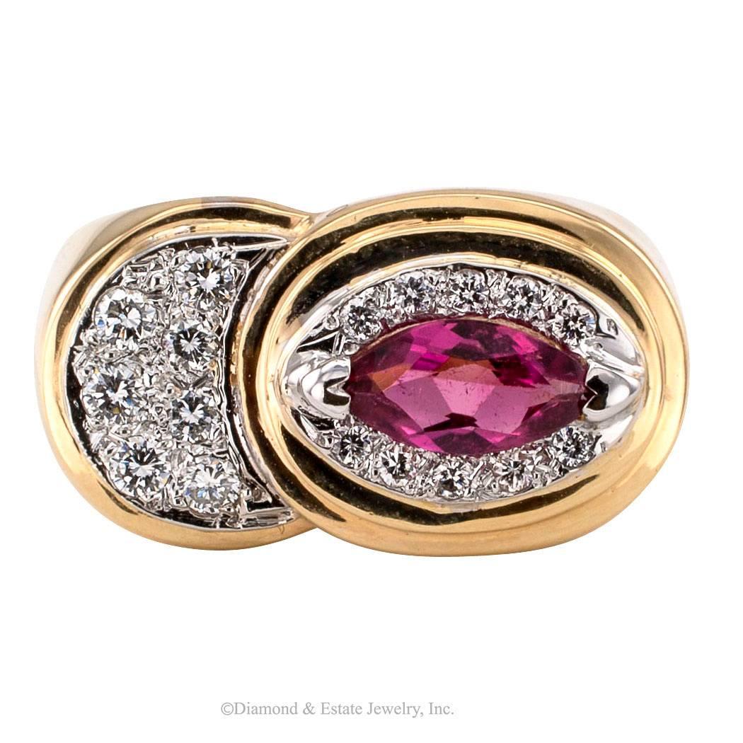 1970s Pink Tourmaline Diamond Gold Ring

1970s pink tourmaline and diamond gold ring. Various elements lend this attractive jewel an avant-garde modernist look that is very easy on the eyes, starting with the off center marquise-shaped pink