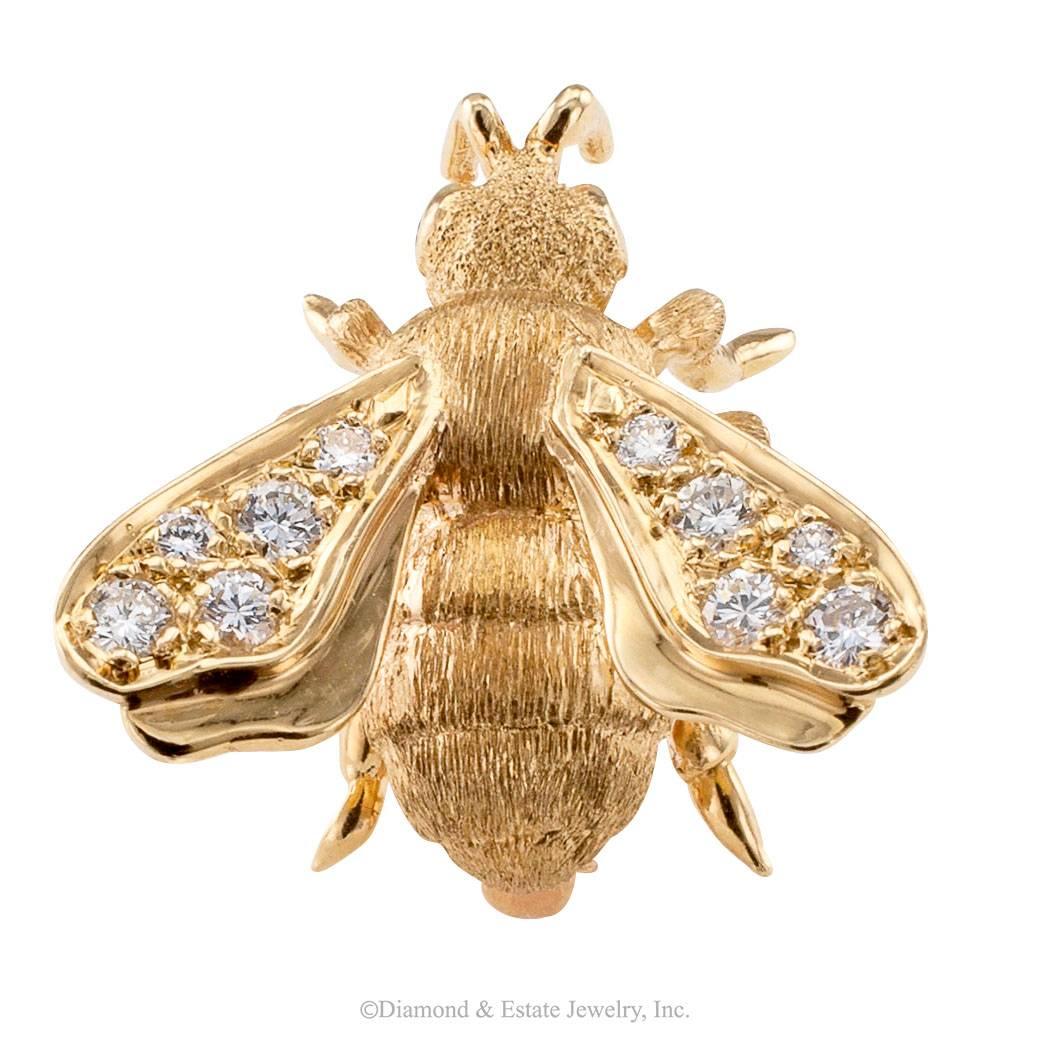 Honey Bee Diamond Gold Brooch

Honey bee gold brooch set with diamonds circa 1970.  Buzzing along with plenty of personality, eyes and wings set with diamonds totaling approximately 0.30 carat, approximately H color and VS clarity, mounted in