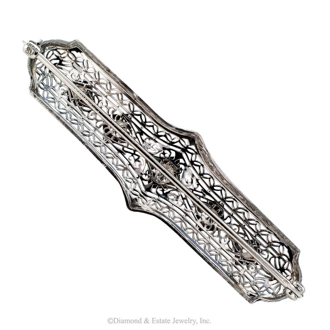 Art Deco Diamond White Gold Platinum Brooch

Art Deco 1925 white gold and platinum diamond bar brooch.  The design features five graduating round diamonds totaling approximately 0.33 carat, approximately I - J color and SI - I clarity, set at equal
