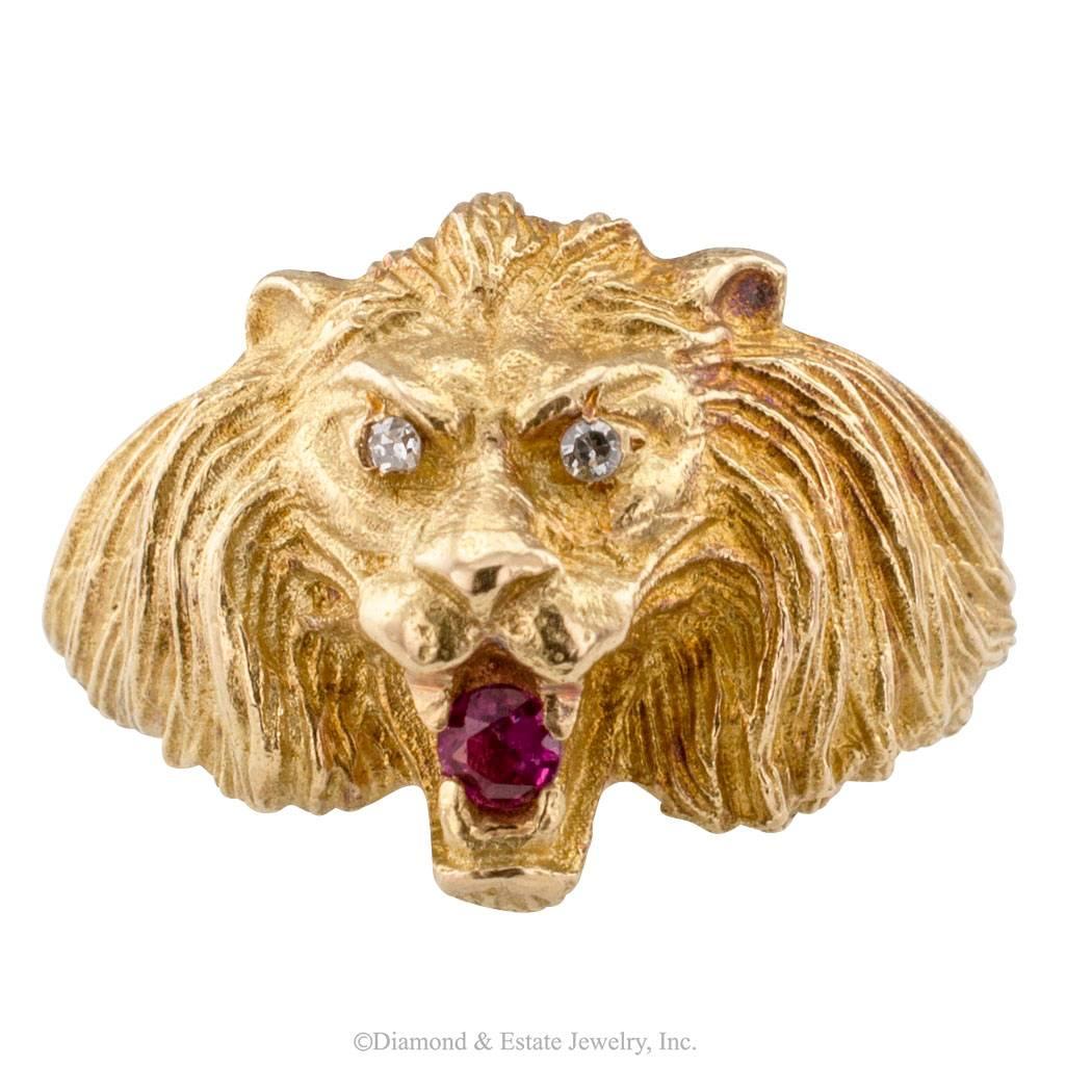 Lion Head Gold Diamond Ruby Ring

Unisex estate lion head gold ring with diamond eyes and ruby mouth.  Sporting a round ruby clutched by its fangs and diamond-set eyes, the copious mane extending over the ring shoulders.  Wearable art by all