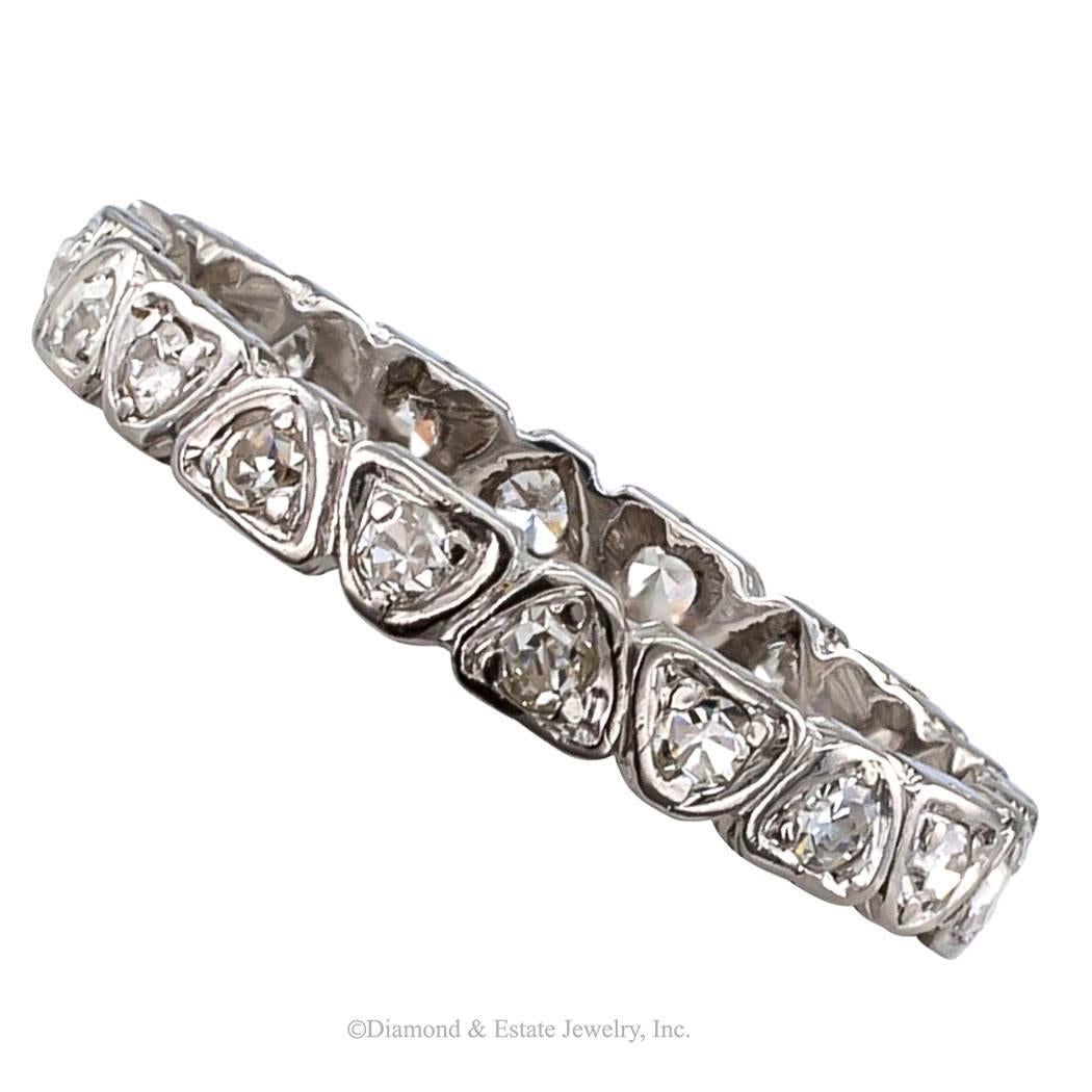 Art Deco 1930s Diamond Platinum Eternity Ring

Art Deco 1930s diamond and platinum eternity ring.  Continuously set in heart-shaped prong-bezels with twenty single-cut diamonds totaling approximately 0.40 carat, mounted in platinum.  
    For over