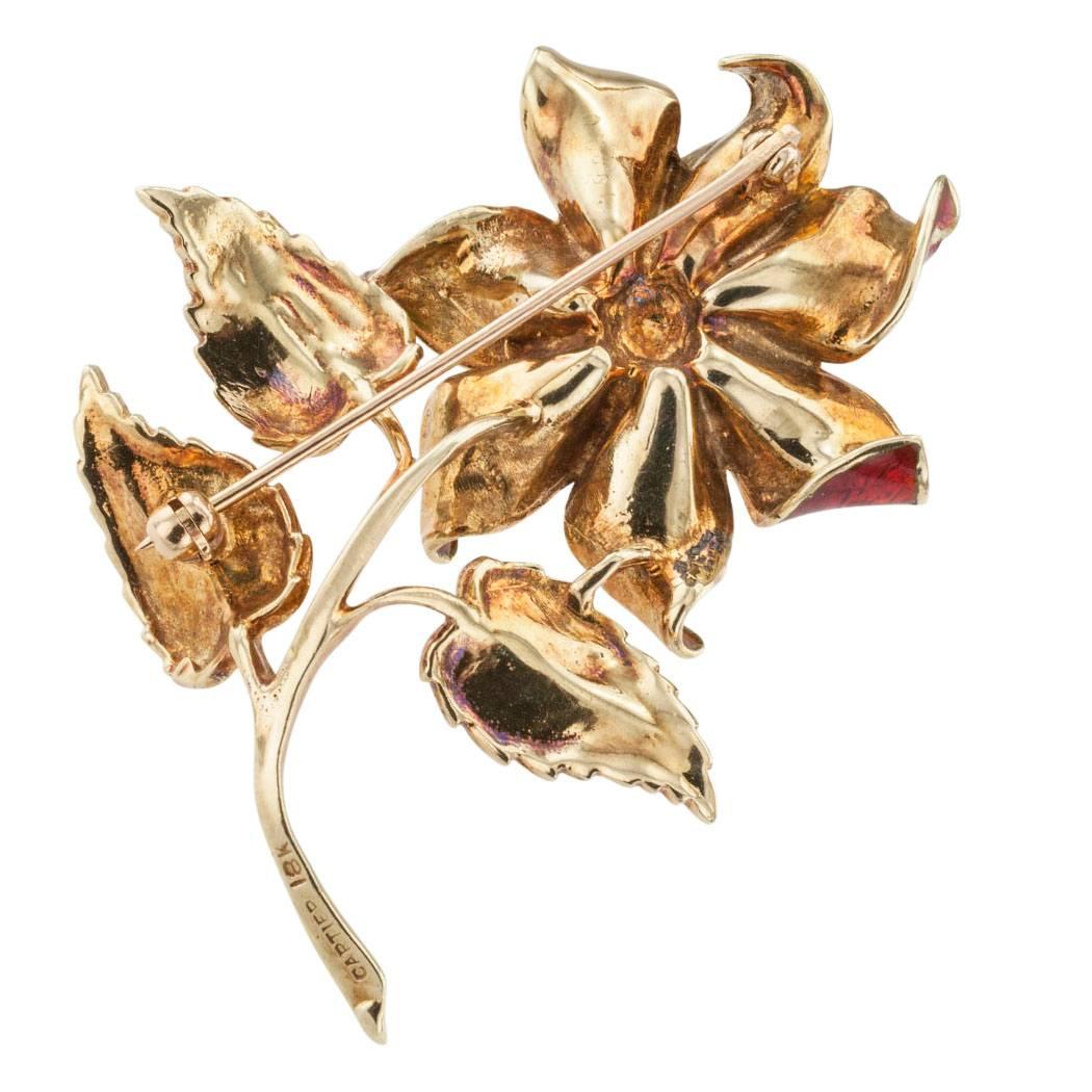 Cartier 1970s Enamel Diamond Flower Brooch

Cartier 1970s diamond enamel and gold brooch.  The single stem flower design centers upon a round brilliant-cut diamond weighing approximately 0.10 carat, approximately G color and VS clarity, mounted in