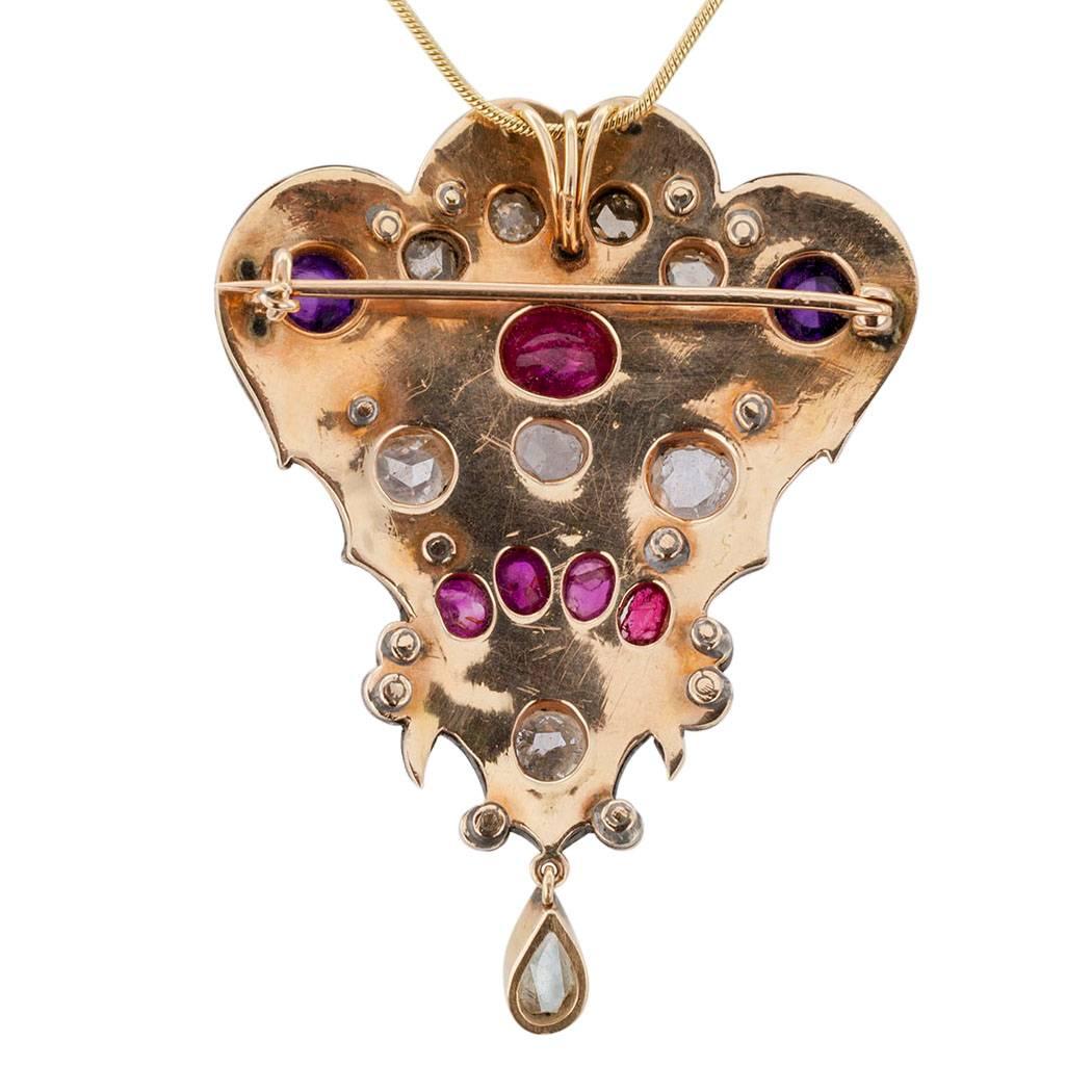 Victorian Diamond Amethyst Ruby Enamel Gold Silver Brooch Pendant

Victorian 1870s suffrage poly chrome enamel amethyst diamond and ruby brooch pendant mounted in gold and silver.  Very engaging to the eye, this magnificent example of Victorian