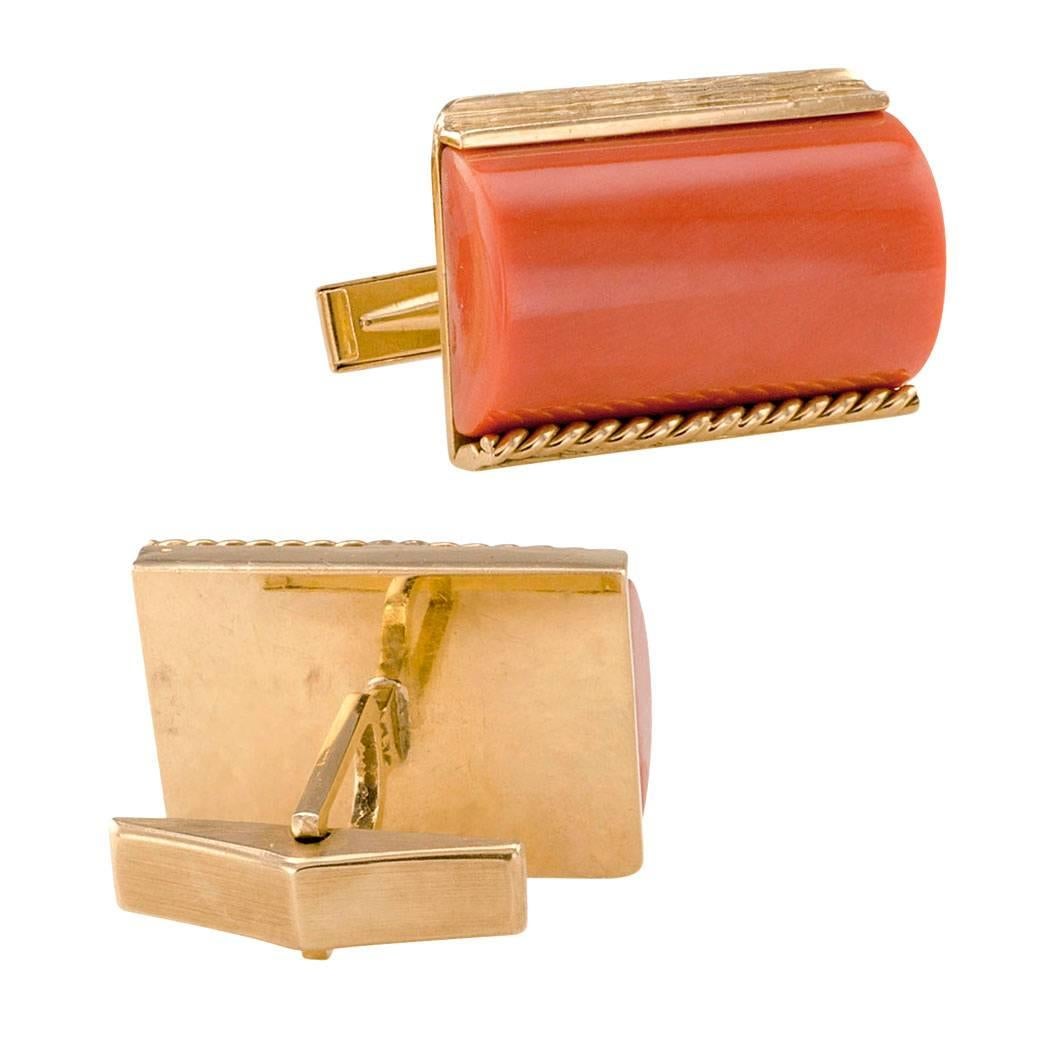 1960 Coral Gold Cuff Links

1960s coral and gold cuff links.  These matching architecturally themed designs feature a pair of salmon colored corals cut in a very interesting shape, tubular, half-rounded rectangles, set into half bezels formed on one