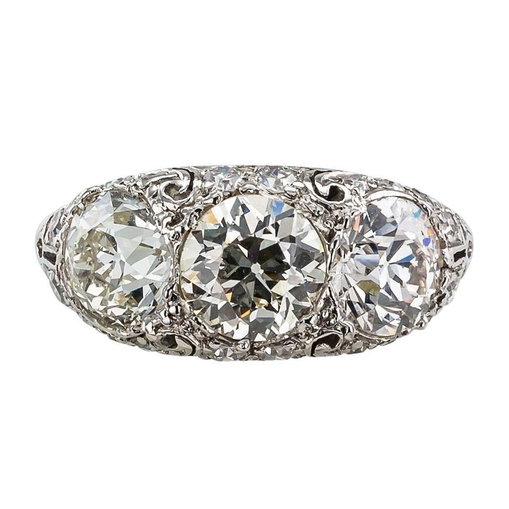 Edwardian Old European Cut Three Stone Diamond Platinum Ring

Edwardian 1910 old European-cut three stone diamond and platinum ring.  The design showcases three large old European-cut diamonds together weighing approximately 3.00 carats,