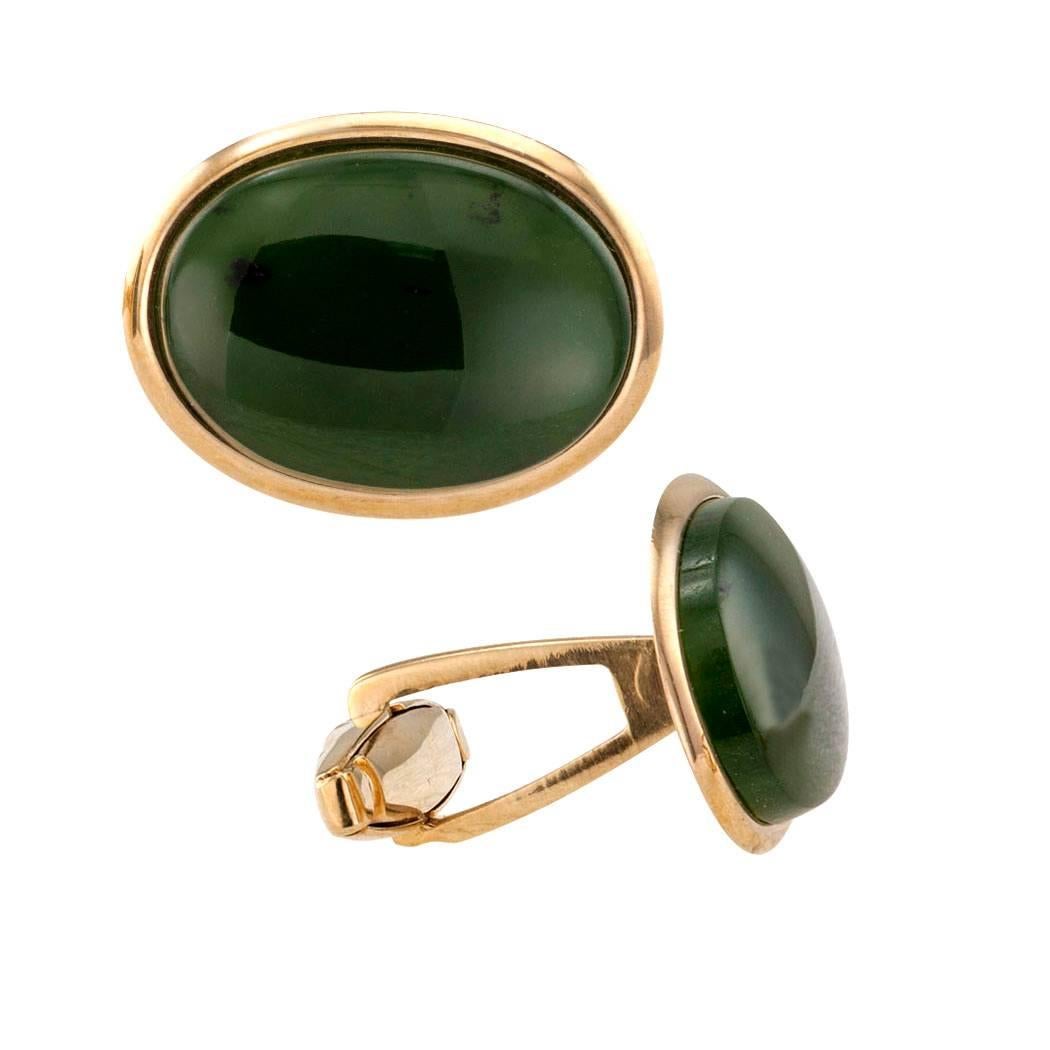 1950s Nephrite Jade Gold Cuff Links

1950s nephrite jade and gold cuff links.  Conservative styling with a very masculine appearance, these cuff links with their characteristic deep forest green color are always in style and are considered by many