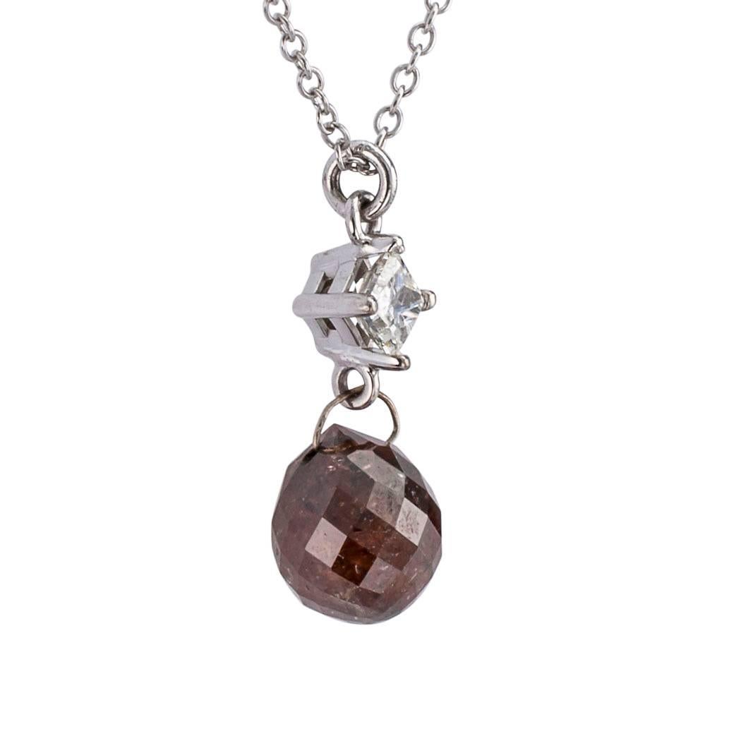 Colored briolette diamond and white gold pendant necklace.
Featuring a Cinnamon Brown colored briolette diamond weighing 2.49 carats, dangling from a square princess-cut white diamond weighing approximately 0.18 carat, approximately H color and I1