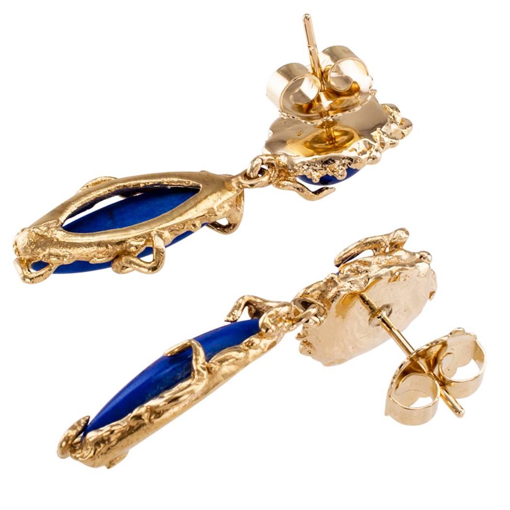 1970s lapis lazuli and gold pendent earrings. Whimsical 14-karat yellow gold pendent earrings featuring a pair of vibrant blue color marquise-shaped lapis lazuli framed by organic gold motifs suspended from the similarly styled surmounts set with