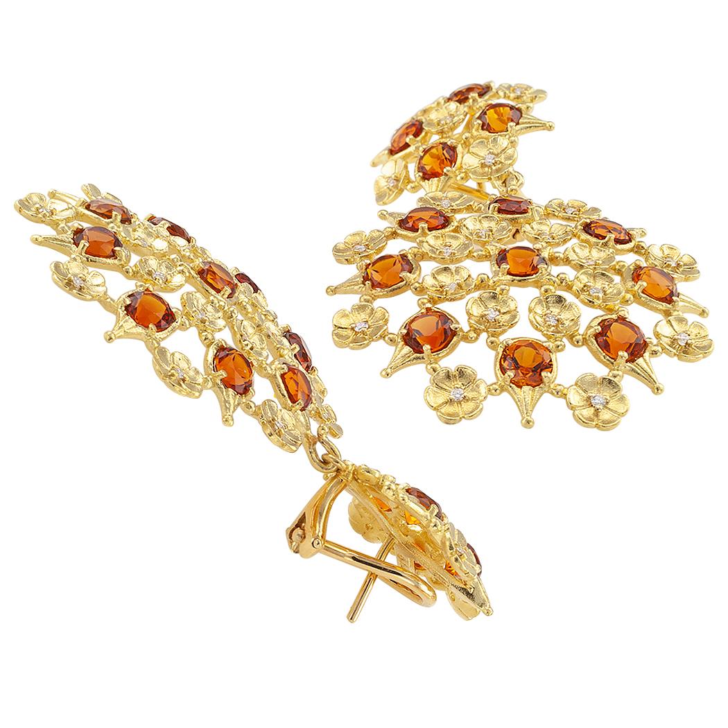 Paul Morelli citrine and diamond gold drop earrings. The matching open work designs feature large discs comprising alternating concentric circles of bright Madeira color citrines and tiny seven-petals gold flowers, to the complimentary surmounts,