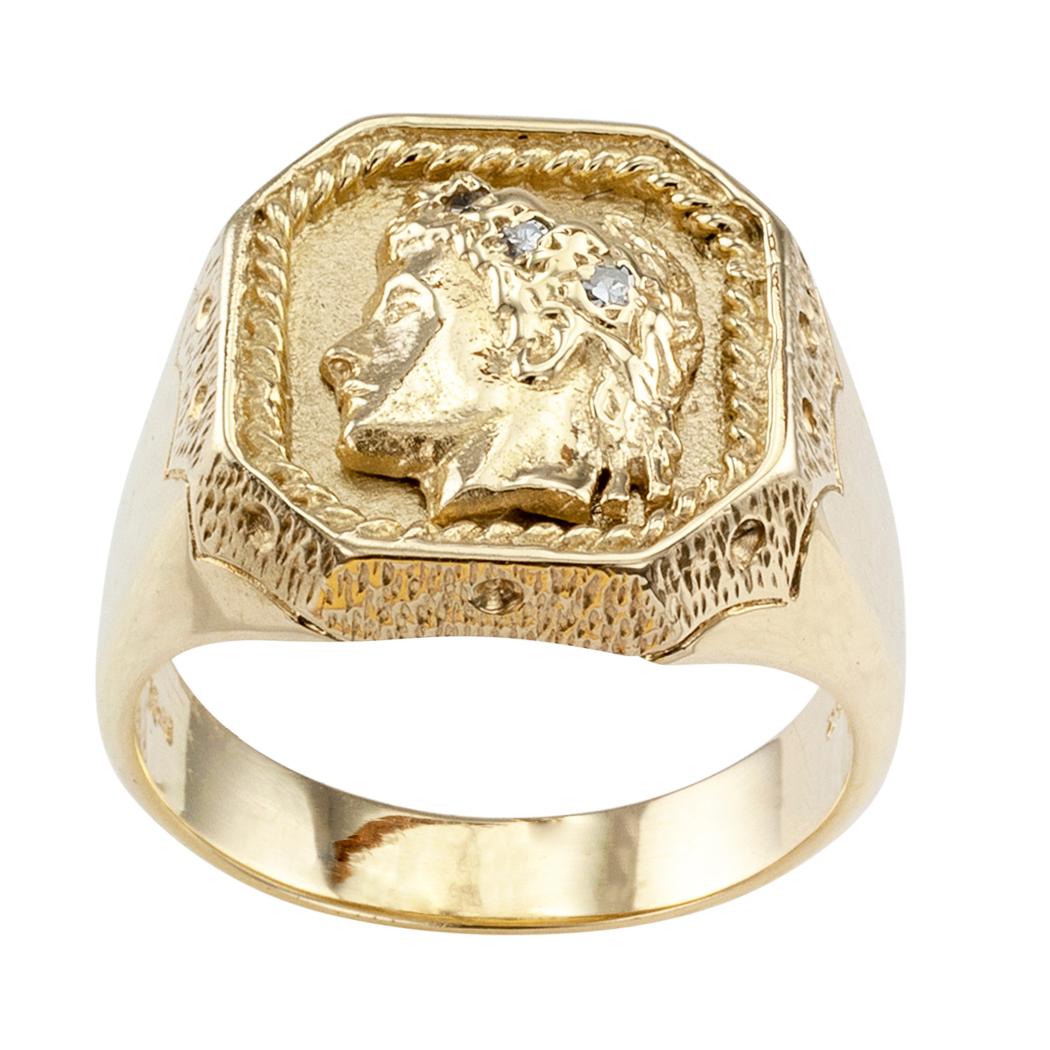 Gentleman’s diamond and gold cameo ring circa 1960. The hexagonal design features the head profile of a classical noble man wearing a laurel wreath set with three round diamonds totaling approximately 0.03 carat, mounted in 14-karat yellow gold.