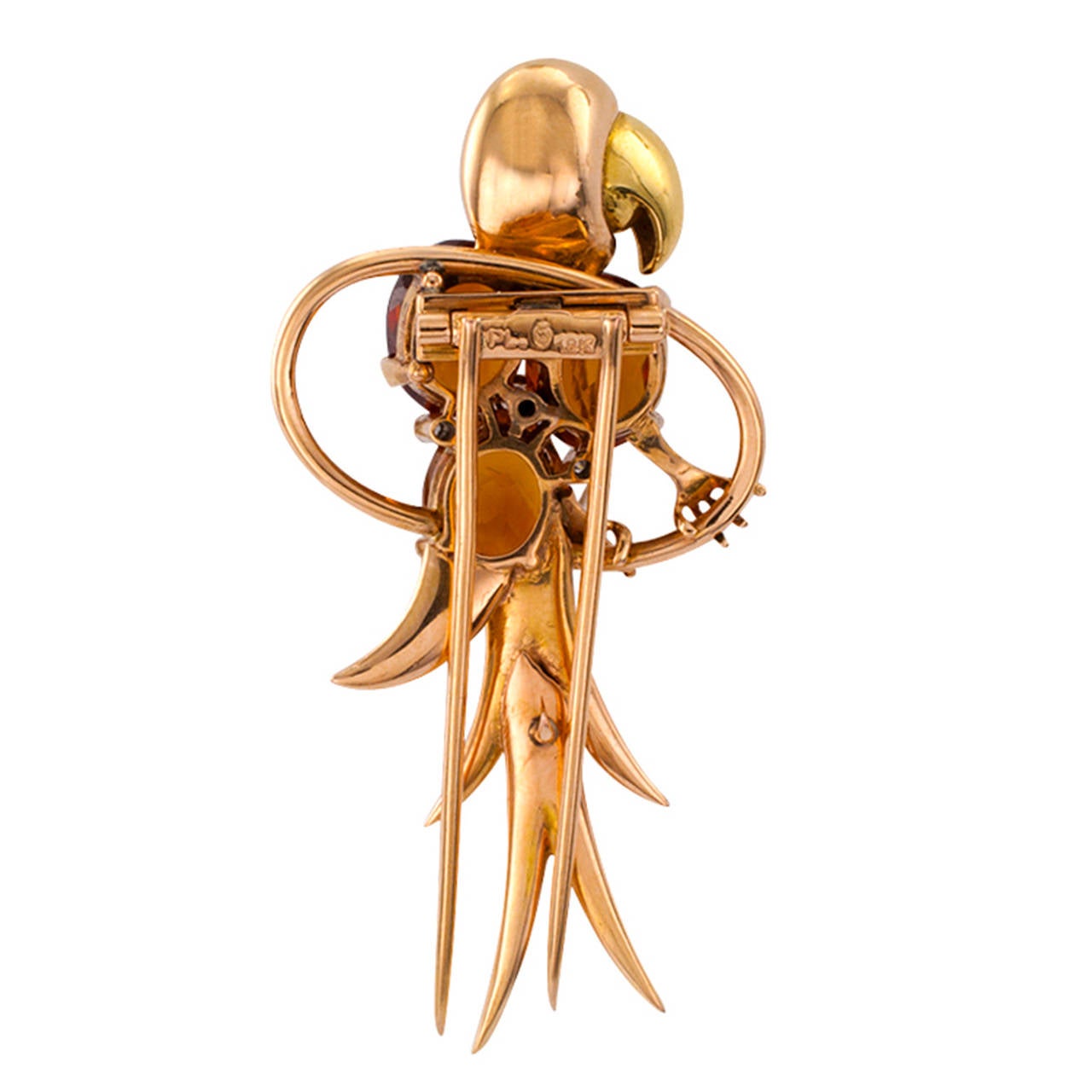 Retro Citrine Gold Parrot Clip/Brooch

Yellow-green and rose 18 karat gold bring a delightful contrast to this whimsical parrot attired in citrine feathers studded with bezel- set rose-cut diamonds, similarly cut diamonds form the eye.  All the