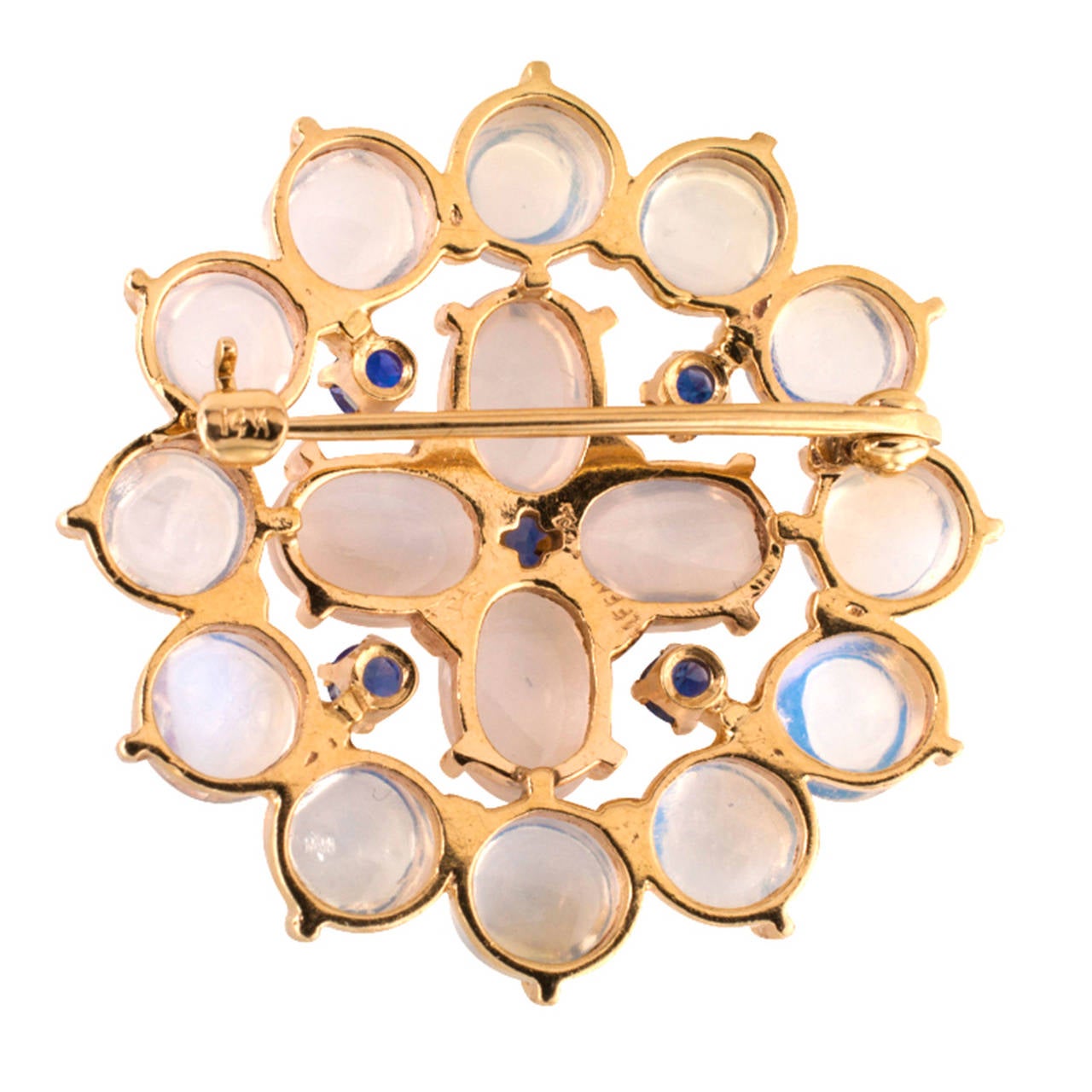 Tiffany & Co.  Estate Brooch

Combining the ethereal glow of moonstones with the regal blue of sapphires, this circle pin has timeless beauty and offers versatility in wardrobe choices in the way that only a well chosen jewel can, especially when