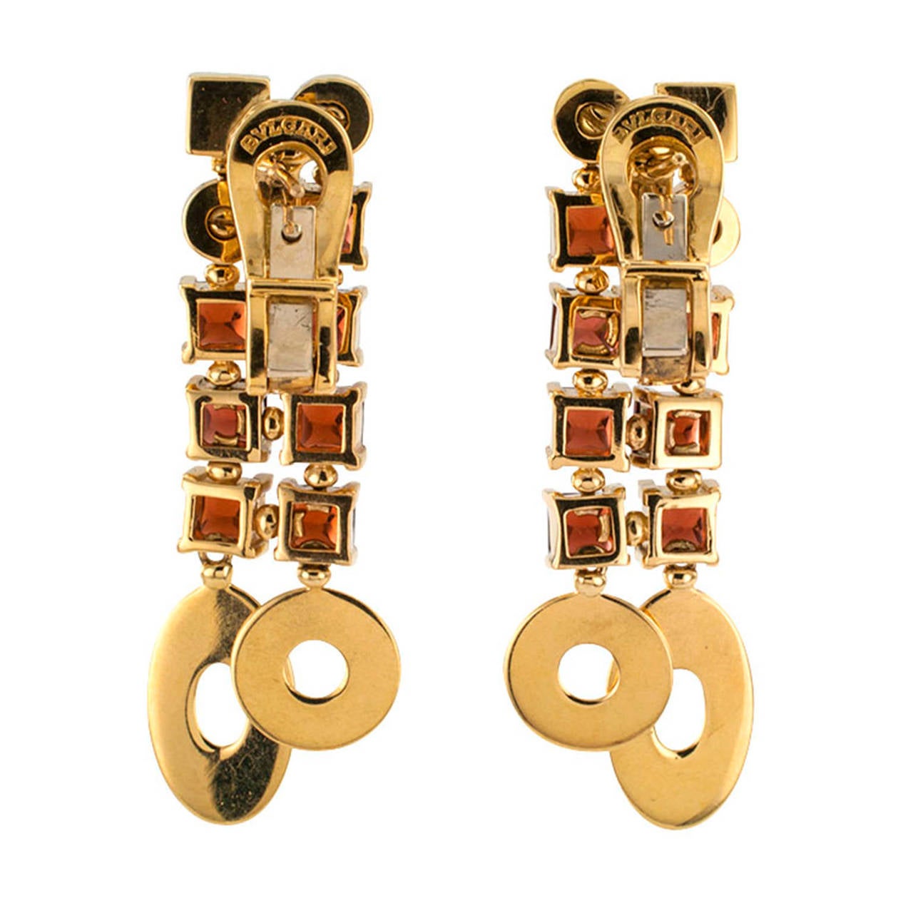 Bvlgari  Garnet And Diamond Pendant Earrings

These really look like fun under the sun or under the moon, smart and chic.  The articulated designs are set with square-cut garnet cabochons and round brilliant-cut diamonds, the latter totaling