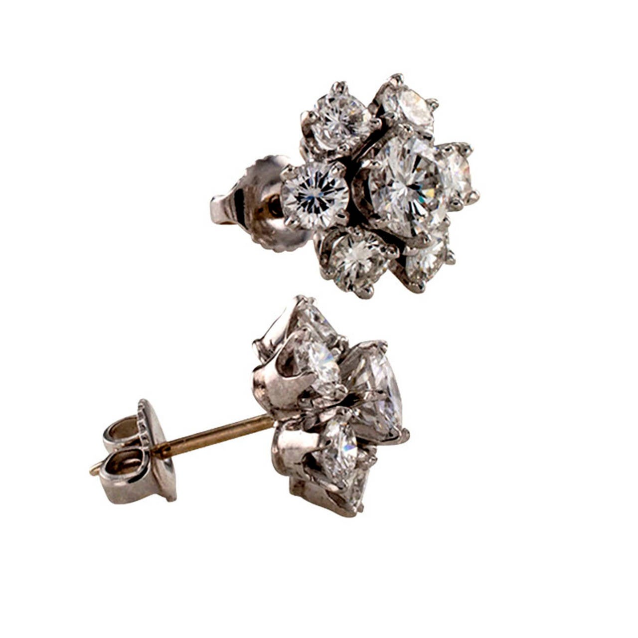 A round diamond cluster earring size, that shows off really nice on the ear and won't get lost if you have long hair because they are set with very nice, bright and sparkly round brilliant-cut diamonds, two larger diamonds together weighing