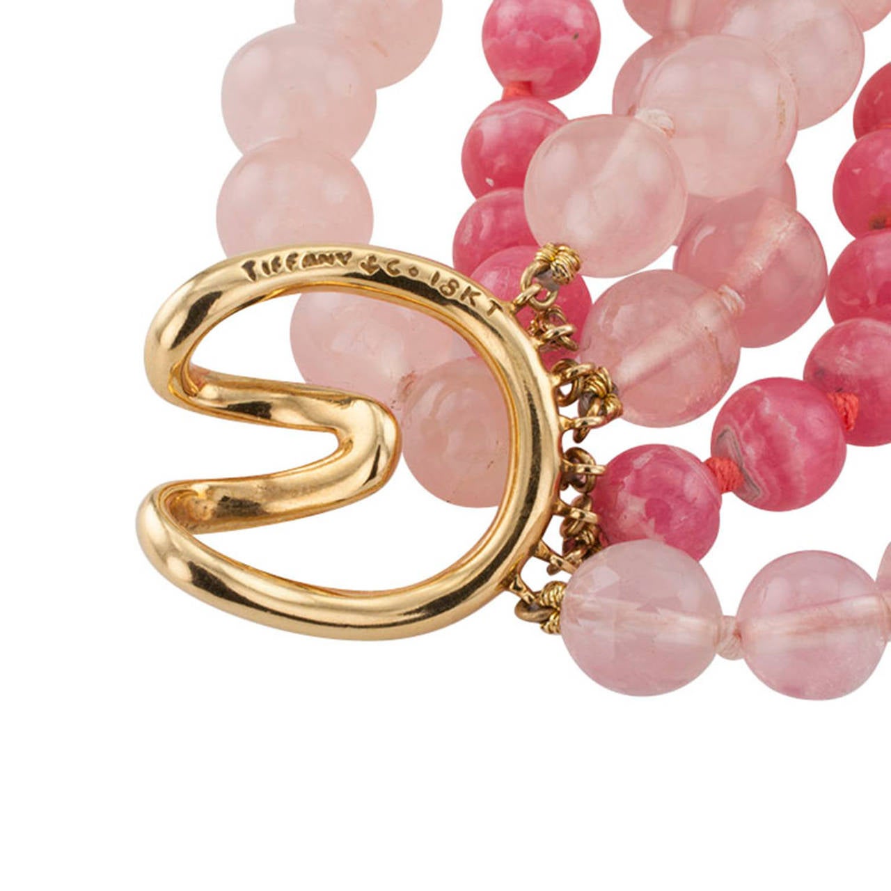 Tiffany & Co. Rhodochrosite And Rose Quartz Torsade Necklace

A very different kind of eye-candy-kind of color combination showcasing a very fine rhodochrosite oval cabochon complemented by six bead strands, two rhodochrosite and four rose quartz,