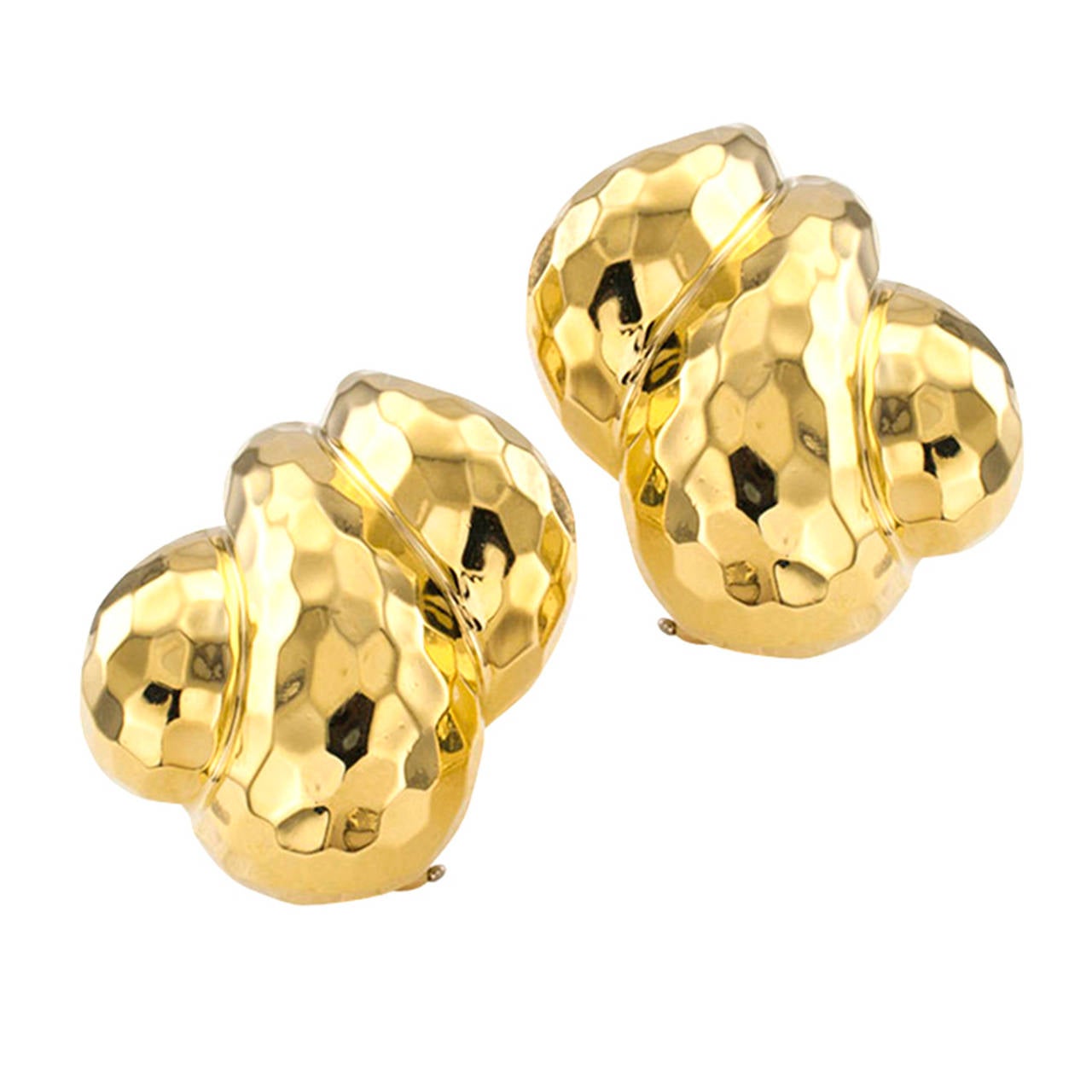 Most definitely, statement making earrings, designed for the woman who has the greatest appreciation for classic, understated elegance.  The left and right matching designs feature a bulbous motif partitioned into three curved and domed sections,