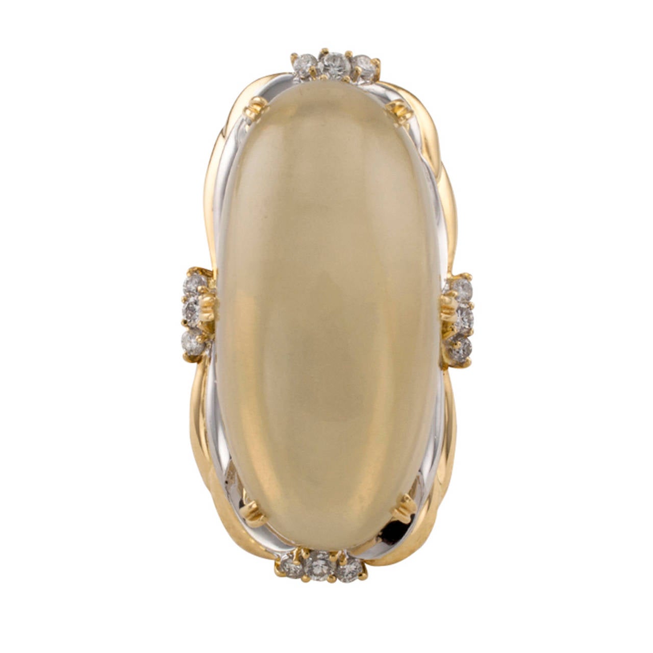 Large And Contemporary Moonstone And Diamond Cocktail Ring

This two-tone ring, in 18 karat yellow gold and platinum, is all about this  large iridescent light-olive-gold pearly moonstone weighing approximately 55.00 carats, prong-set on a simple,