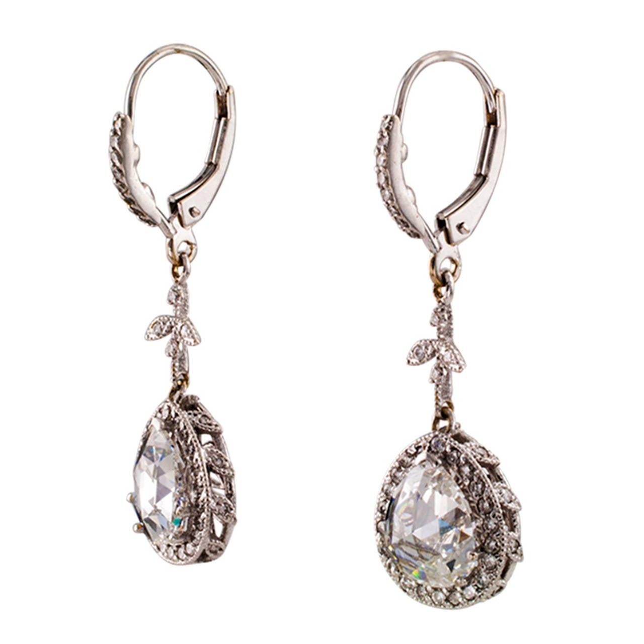 2.25 Carats t.w. Pear-Shaped Rose-Cut Diamond Drop Earrings

The contemporary swinging designs feature a pair of fiery and bright pear-shaped rose-cut diamonds together weighing approximately 2.25 carats, approximately F - G color and SI clarity,