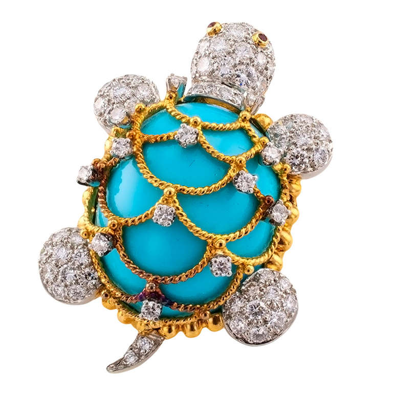This whimsical designed turtle features a very fine, high domed, turquoise cabochon, crisscrossing corded gold, studded with diamonds defines the turtle's shell, all extremities pave-set with diamonds totaling approximately 2 1/2 carats