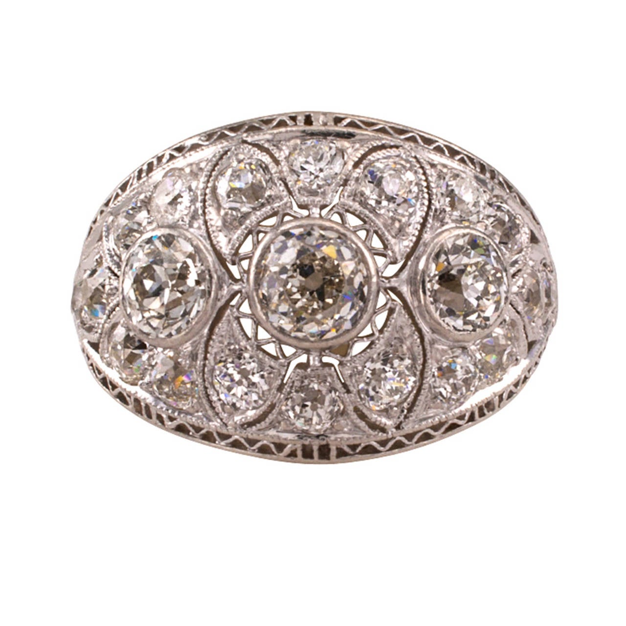 Edwardian Diamond Saddle Ring Band

The slightly domed design lays across the finger like a fine tapestry of diamonds and delicate filigree work, like a small slice off of The Milky Way to admire and enjoy right on your finger, glittering and